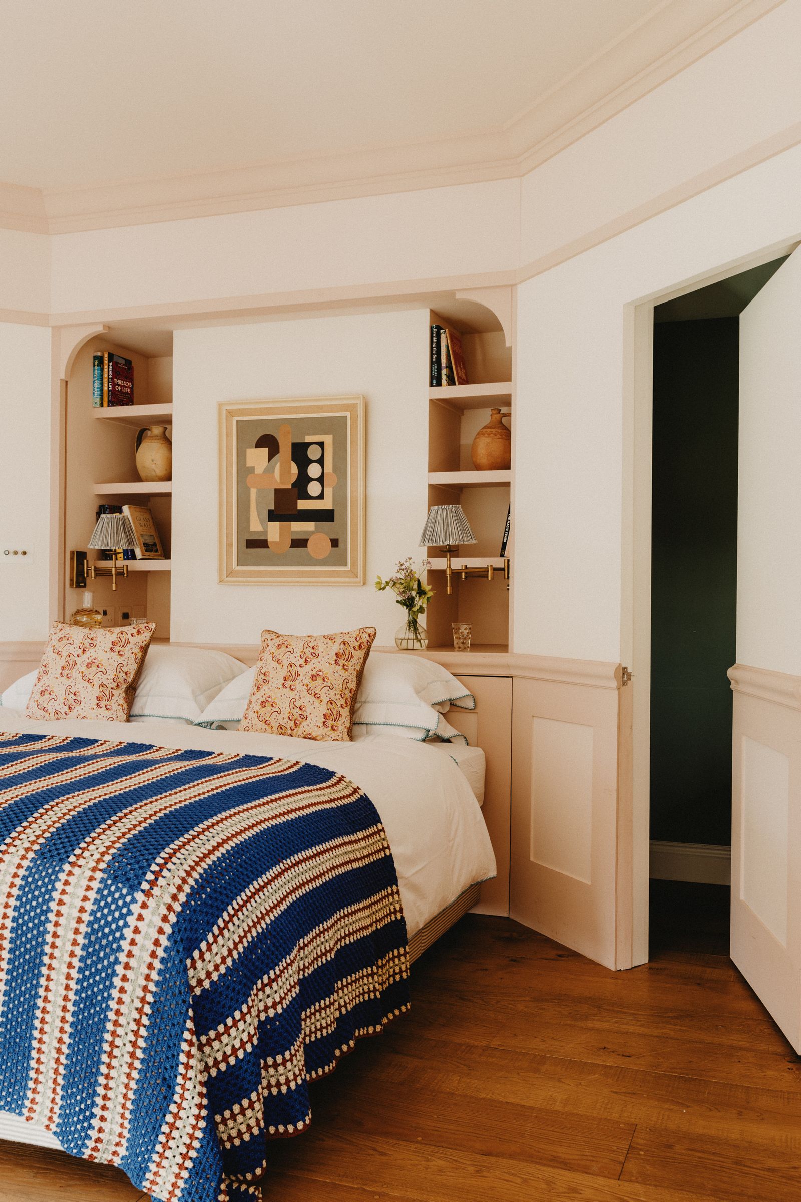 Image may contain Corner Indoors Interior Design Cushion Home Decor Bed Furniture Art Painting Lamp and Bedroom