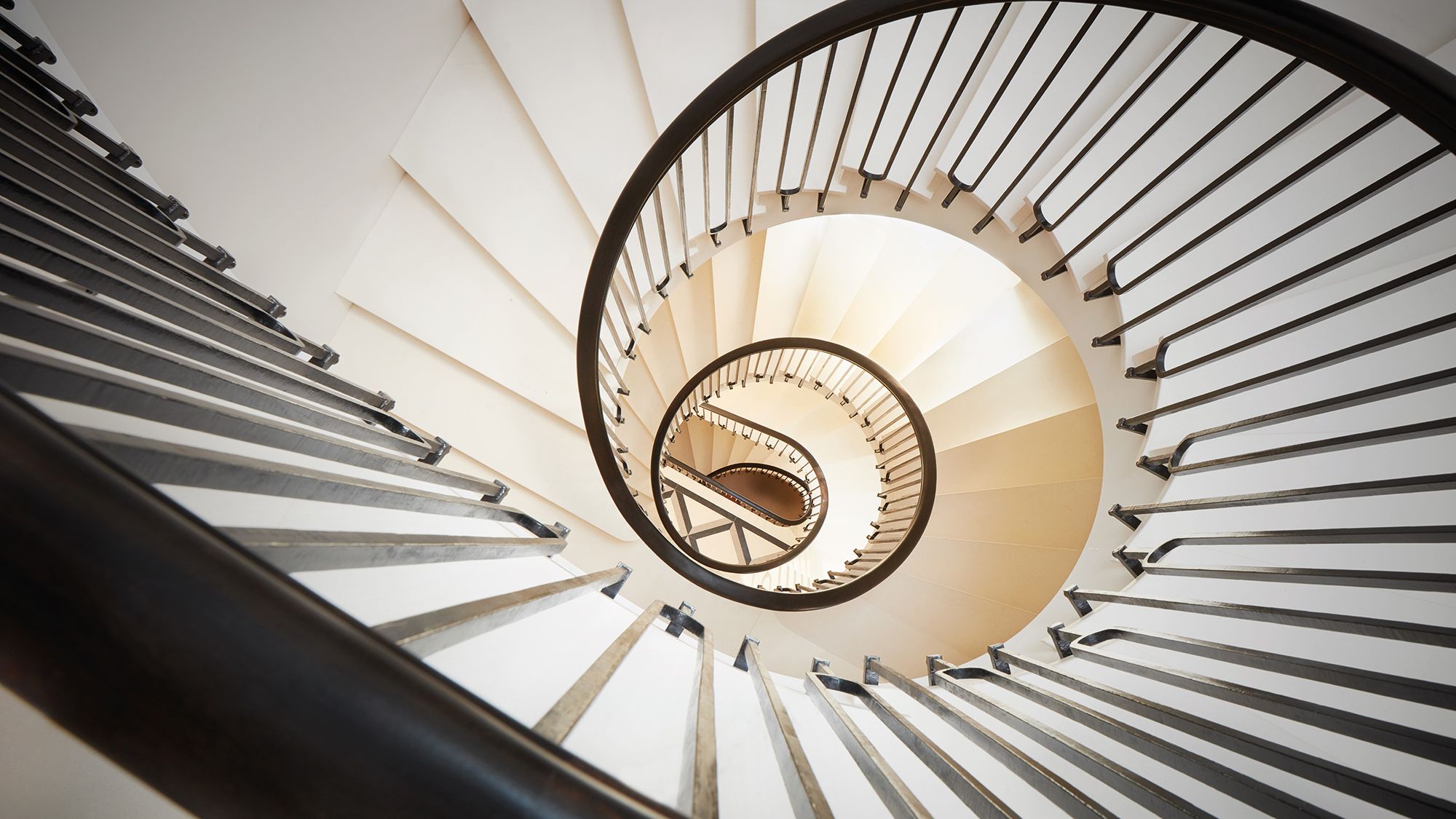 Image may contain: Architecture, Building, House, Housing, Staircase, Handrail, and Spiral