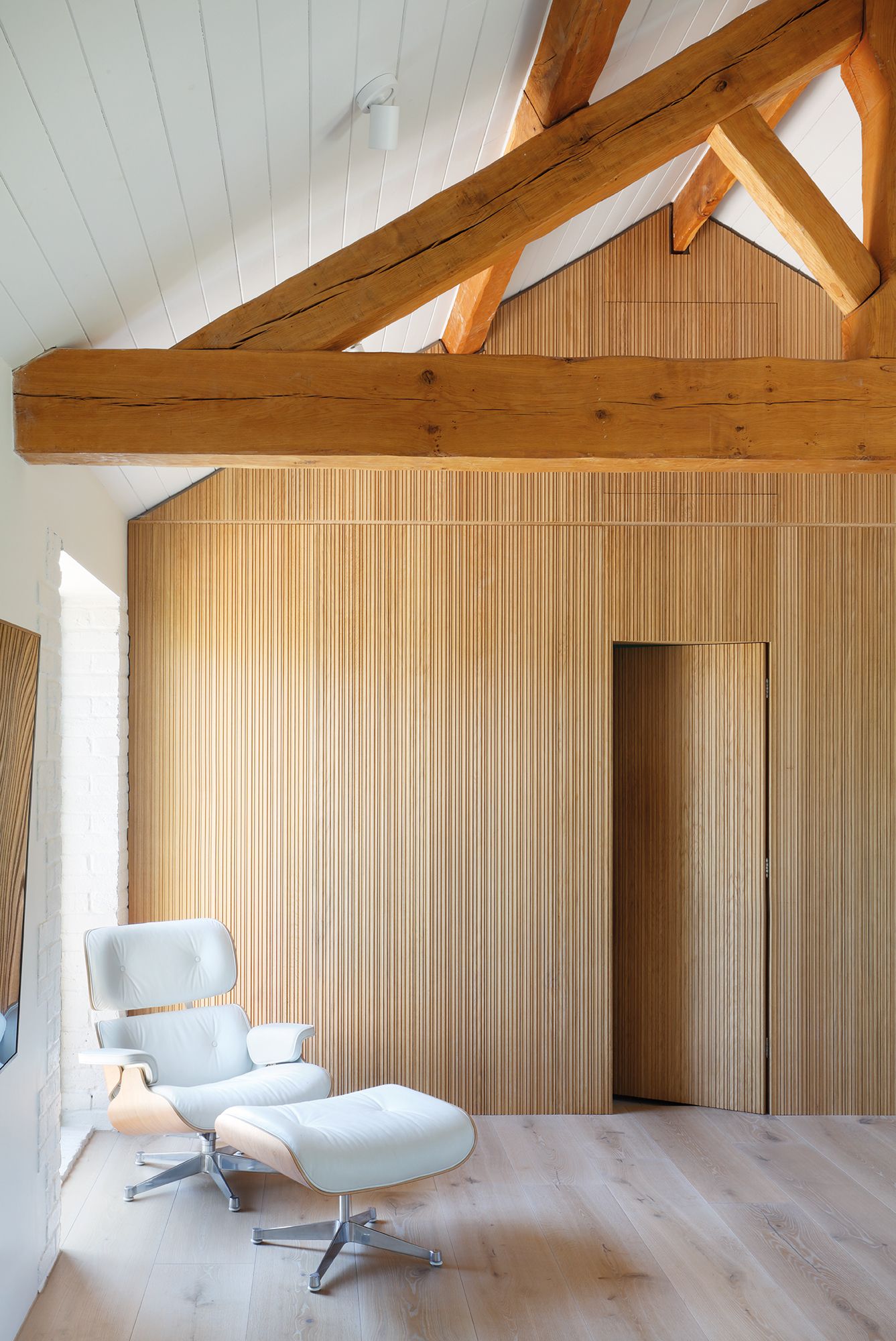 Image may contain: Indoors, Interior Design, Chair, Furniture, Wood Panels, Wood, Hardwood, and Stained Wood