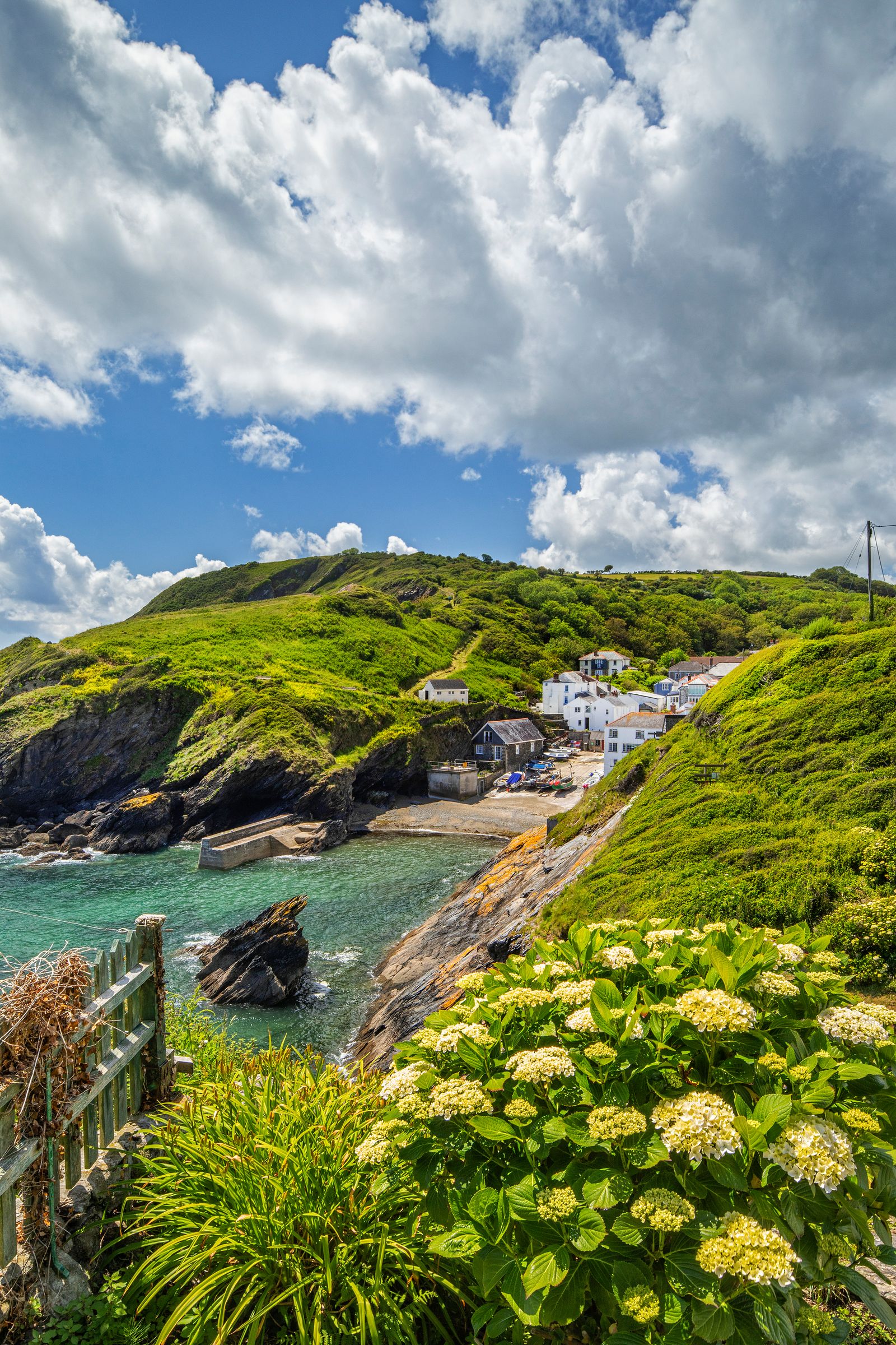Image may contain Nature Outdoors Scenery Sea Water Sky Summer Landscape Rock Countryside Promontory and Land