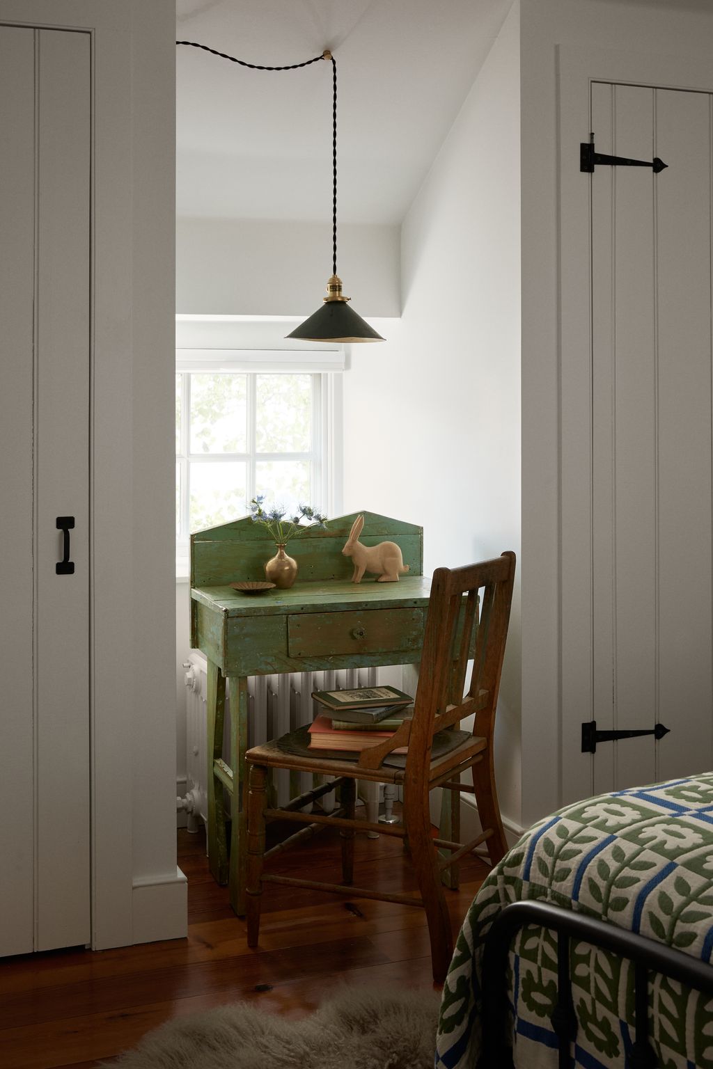 Image may contain Indoors Interior Design Chair Furniture Lamp Home Decor Bed Rug Floor and Corner