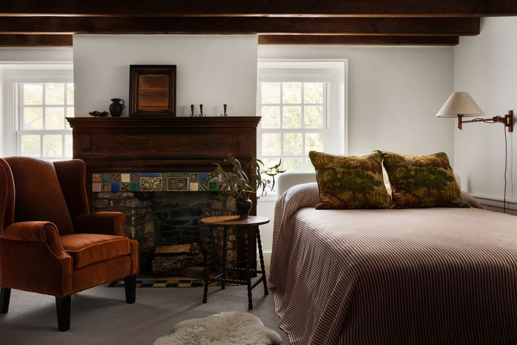 Image may contain Plant Fireplace Indoors Lamp Home Decor Bed Furniture Chair Cushion Rug and Interior Design