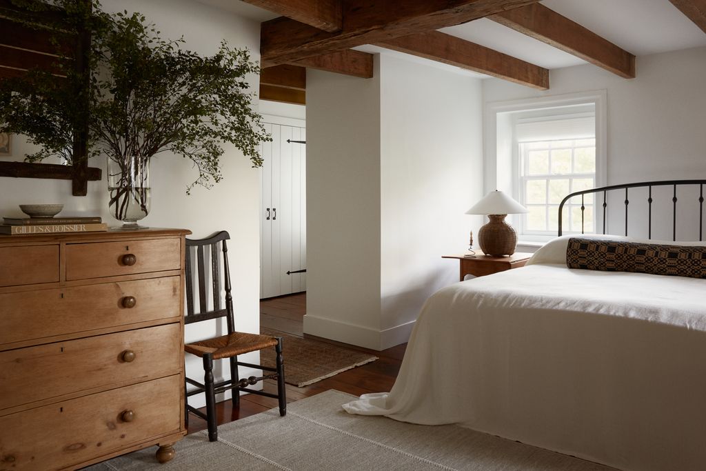 Image may contain Indoors Interior Design Lamp Chair Furniture Bed Home Decor Rug Cabinet Bedroom Room and Wood