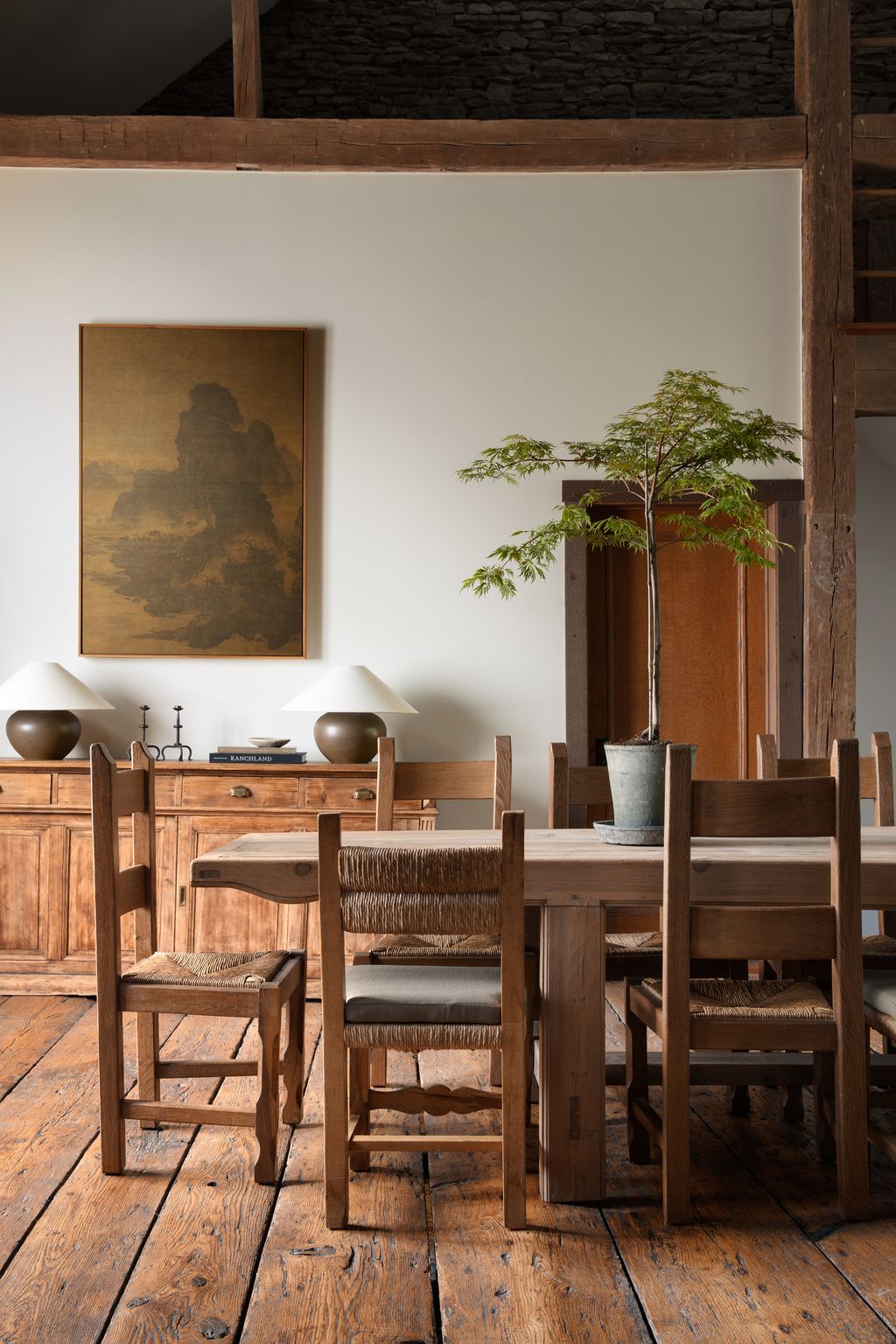 Image may contain Indoors Interior Design Wood Architecture Building Dining Room Dining Table Furniture and Room