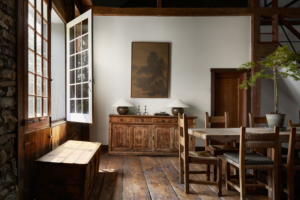 Image may contain Indoors Interior Design Architecture Building Dining Room Dining Table Furniture Room and Table