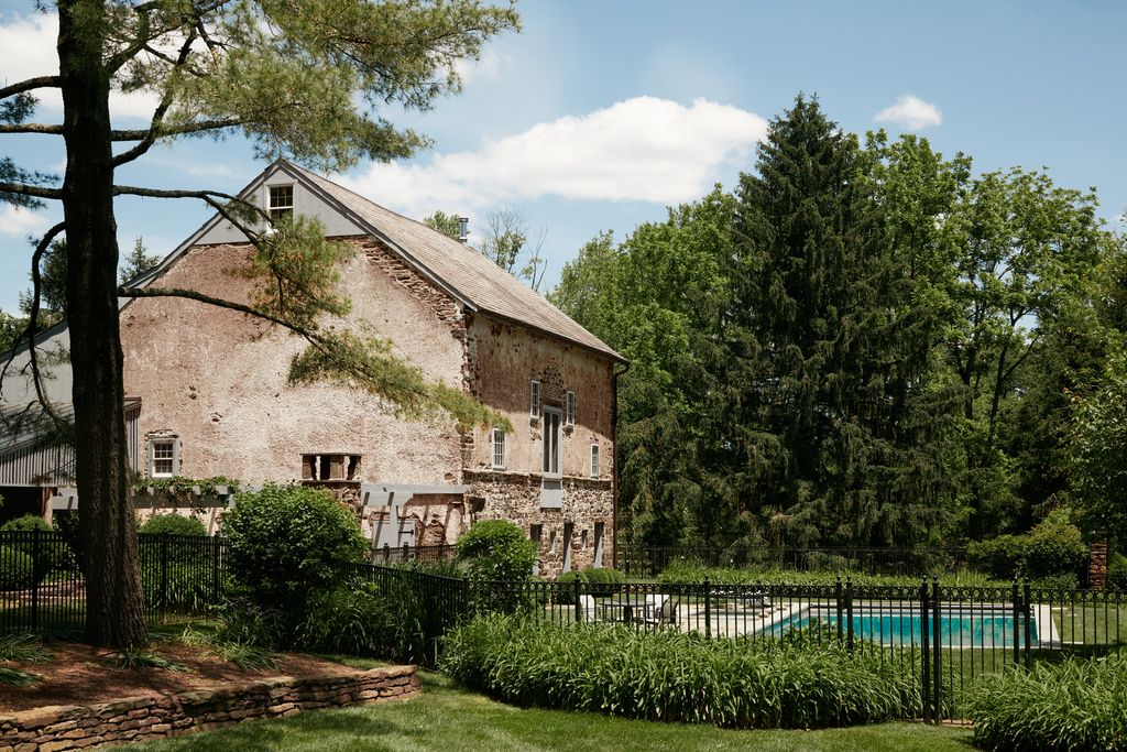 Image may contain Architecture Building Cottage House Housing Villa Nature Outdoors Scenery Grass and Plant