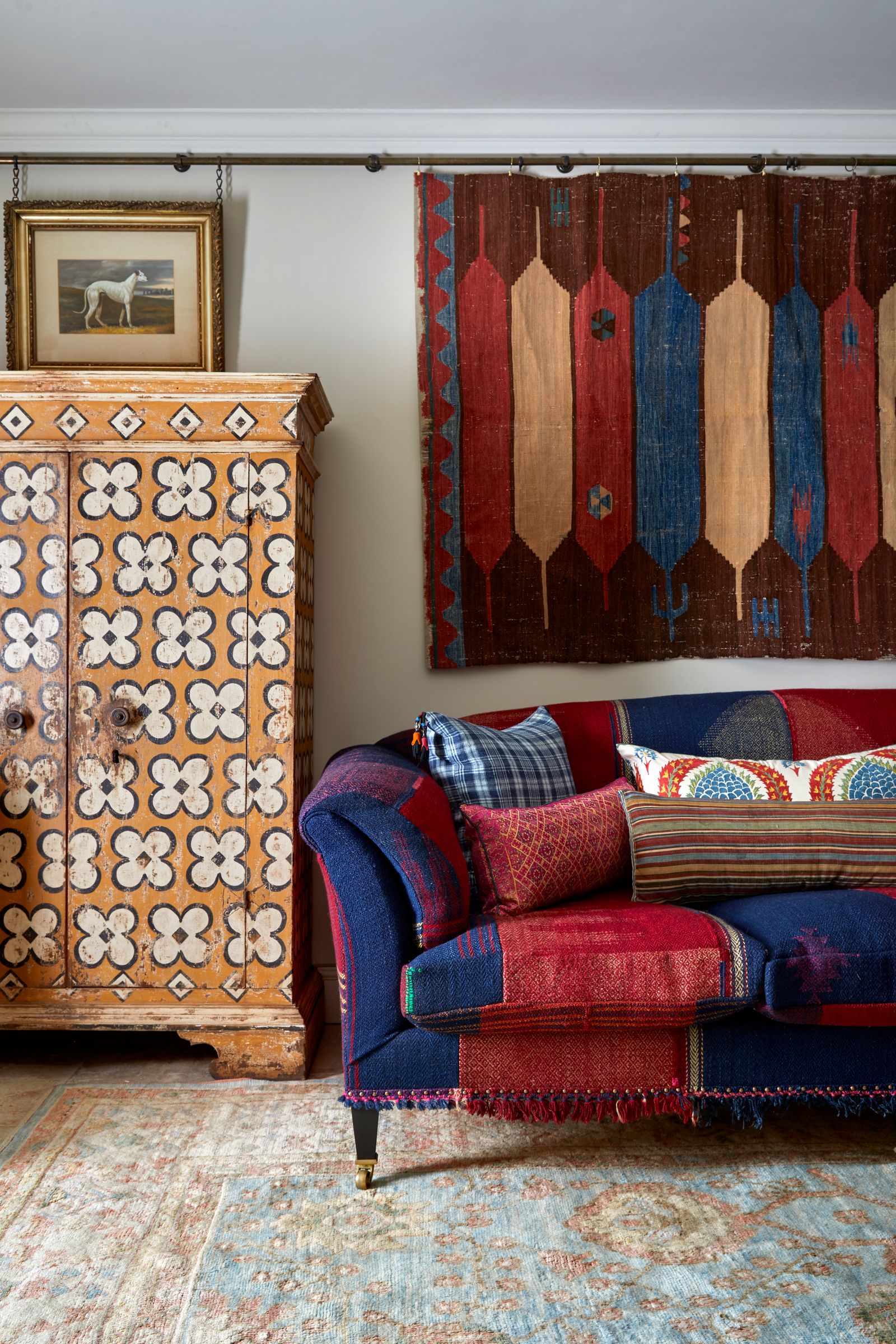 Image may contain Home Decor Rug Indoors Interior Design Couch Furniture Art Painting Animal Canine and Dog