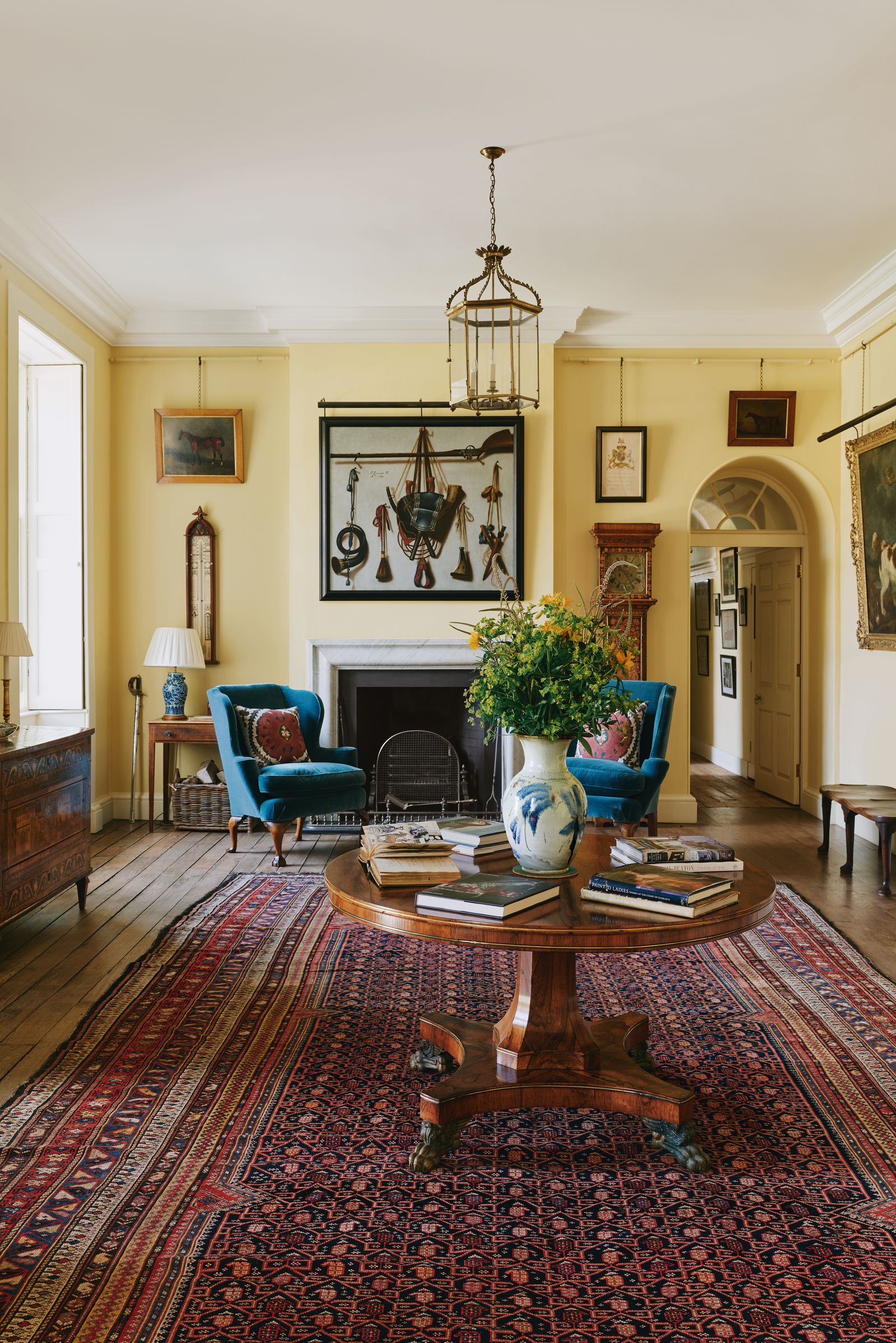 Image may contain Home Decor Rug Book Publication Lamp Art Painting Chair Furniture Architecture and Building