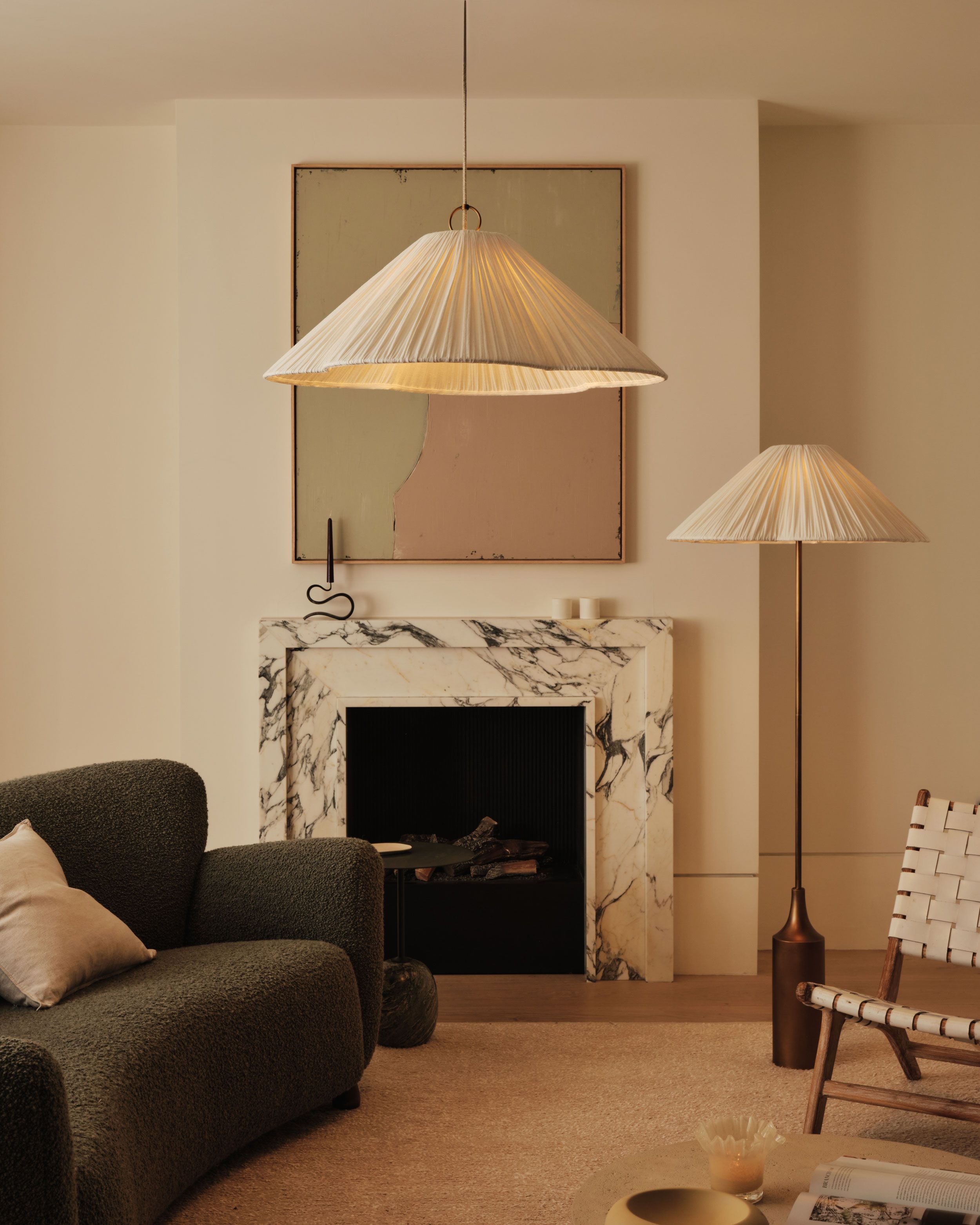 Image may contain: Lamp, Fireplace, Indoors, Couch, Furniture, Chair, Interior Design, Architecture, and Building