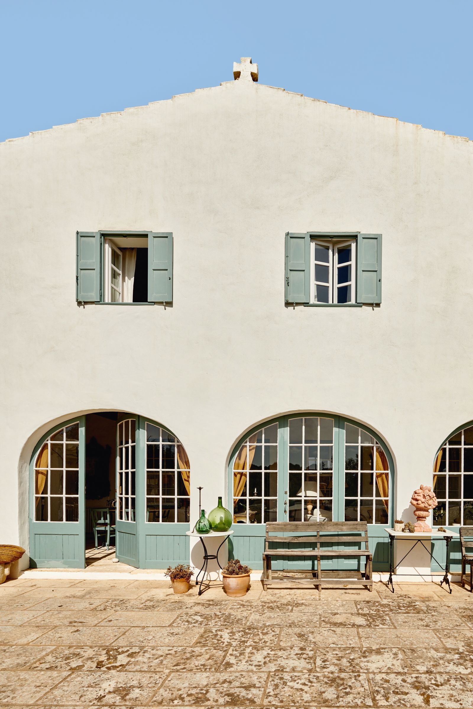 Image may contain Architecture Building House Housing Villa Outdoors Shelter Plant Bench Furniture Desk and Table