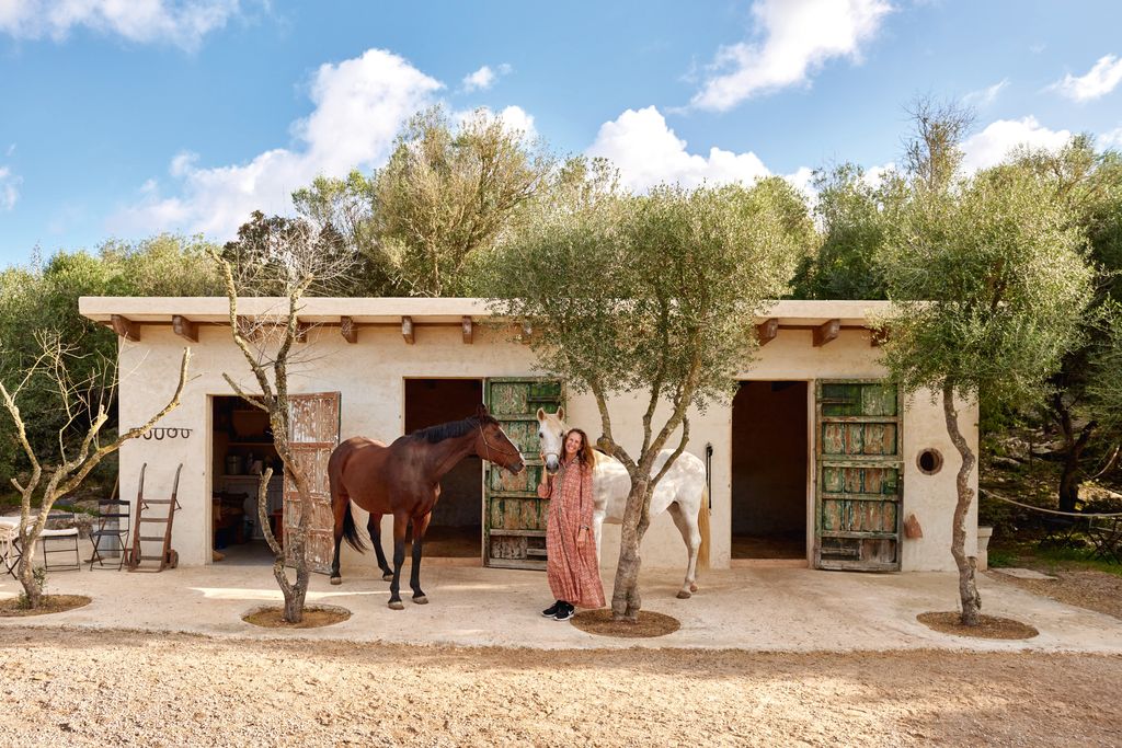 Image may contain Architecture Building House Housing Villa Outdoors Shelter Person Chair and Furniture