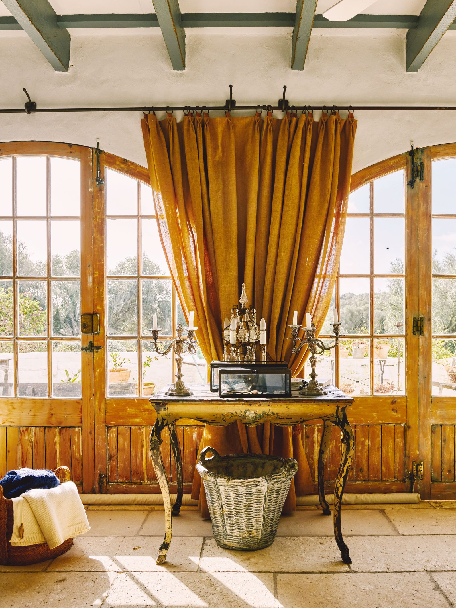Image may contain Indoors Interior Design Desk Furniture Table Plant Hardwood Stained Wood Wood and French Window