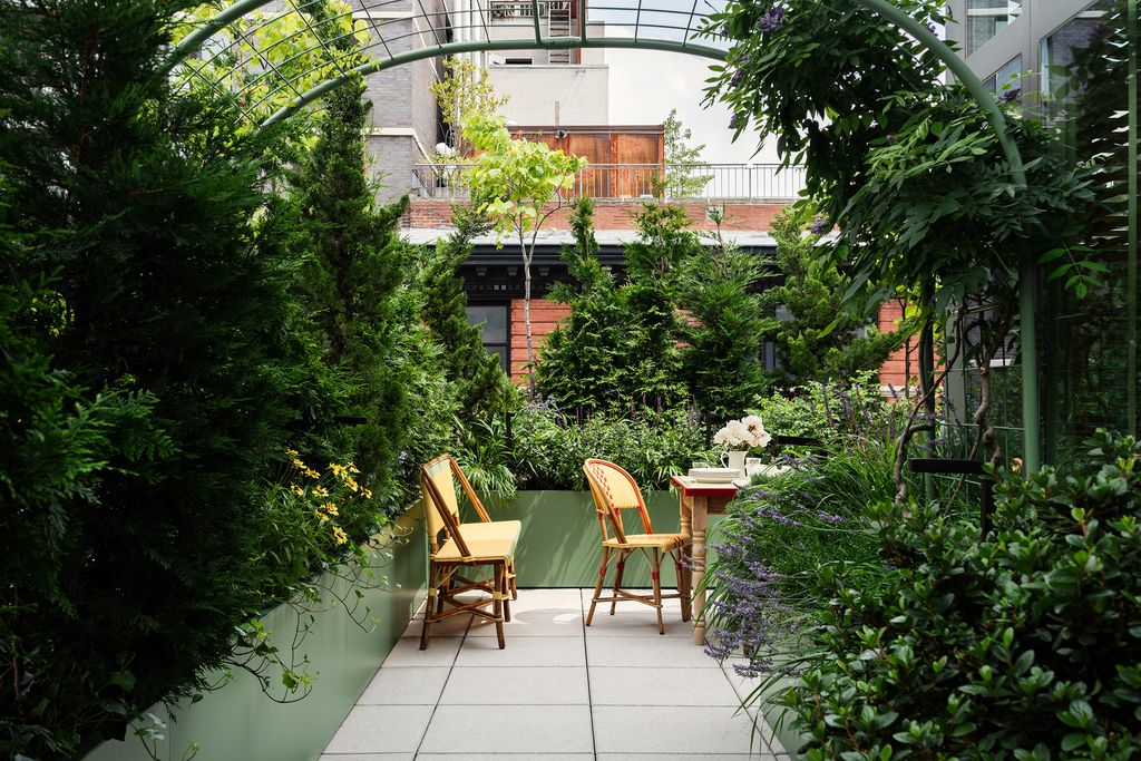 Image may contain Garden Nature Outdoors Backyard Yard Chair Furniture Terrace Arbour Gardening and Architecture