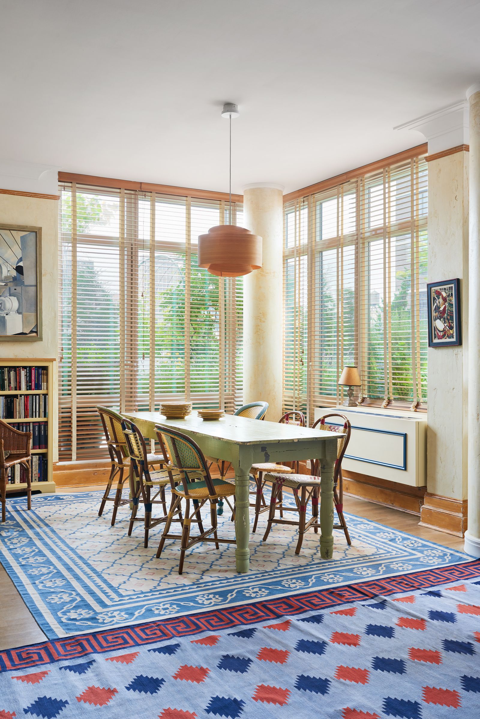 Image may contain Home Decor Lamp Rug Chair Furniture Art Painting Table Window Desk and French Window