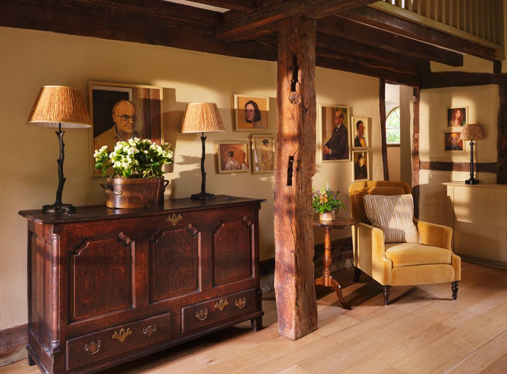 Image may contain Lamp Indoors Interior Design Person Chair Furniture Art Painting Table Lamp and Accessories