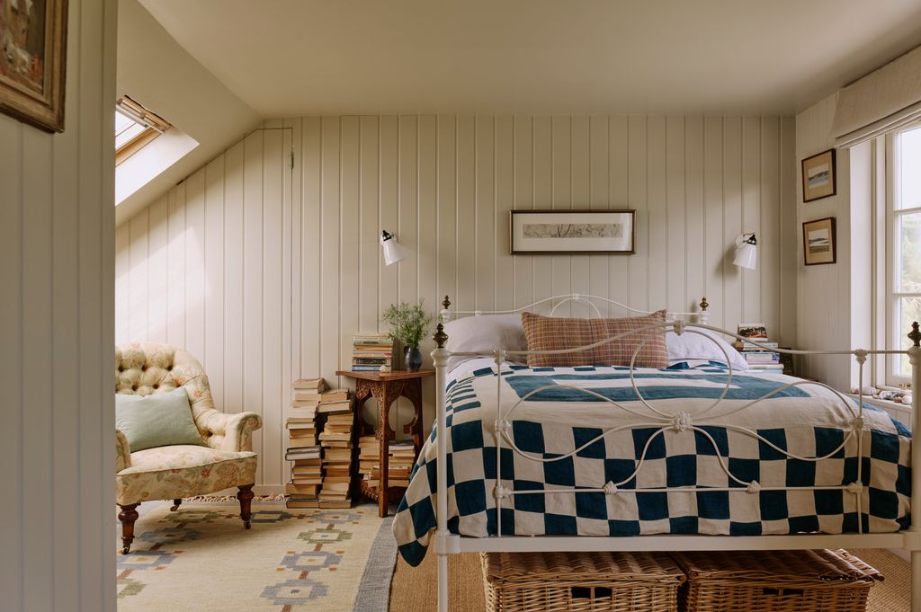 Image may contain Indoors Interior Design Home Decor Bed Furniture Plant Art Painting Chair Rug and Cushion