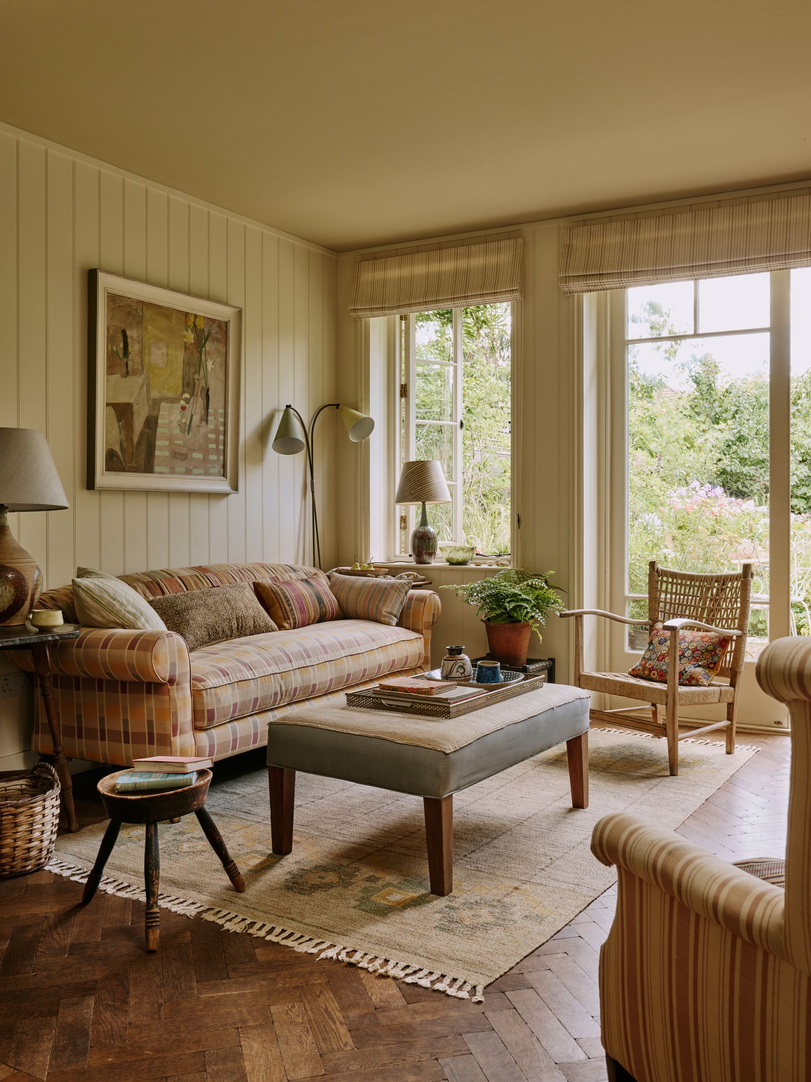 Image may contain Home Decor Lamp Art Painting Chair Furniture Plant Couch Rug Indoors and Interior Design