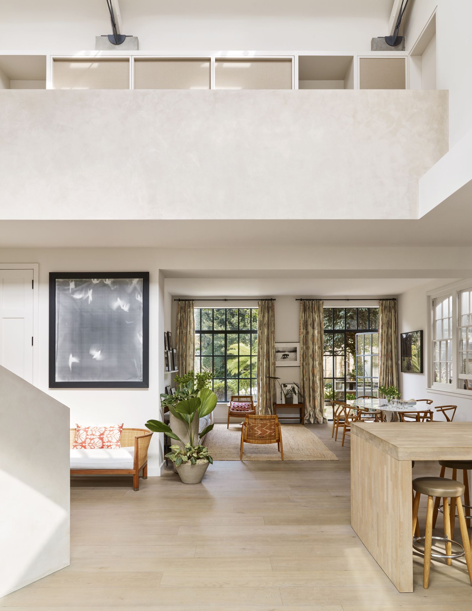 Image may contain Indoors Interior Design Chair Furniture Plant Dining Table Table Floor Desk Art and Painting