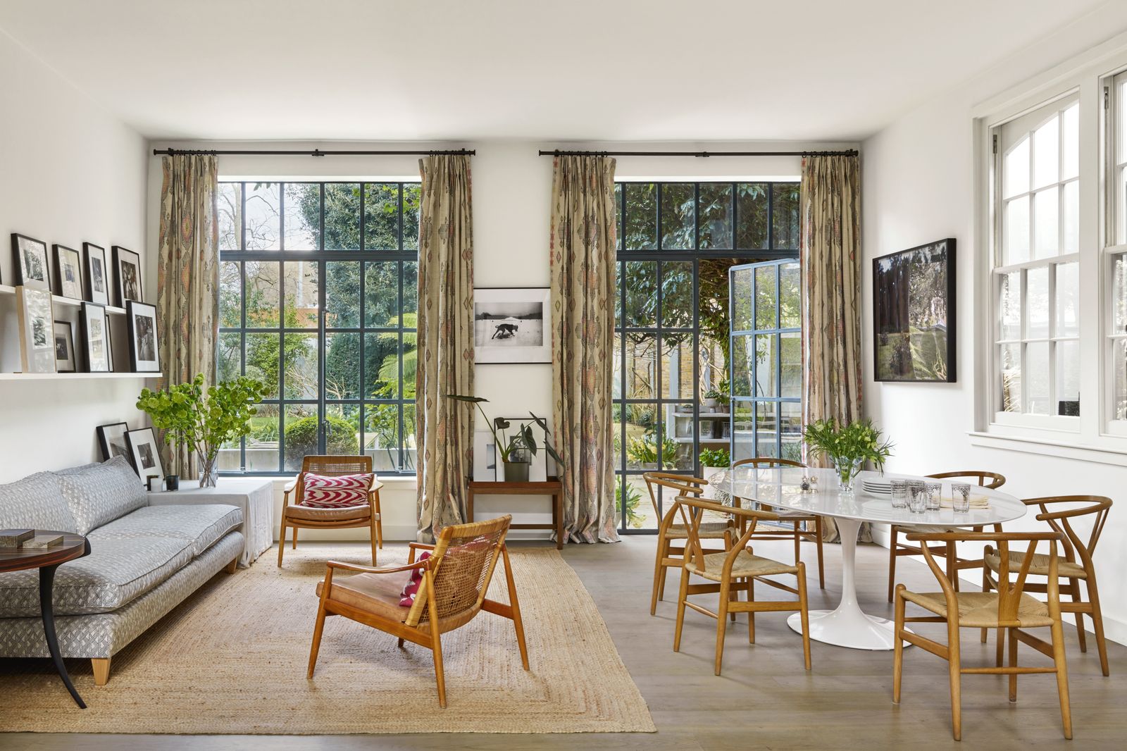 Image may contain Chair Furniture French Window Window Home Decor Rug Art Painting Table Couch Plant and Desk