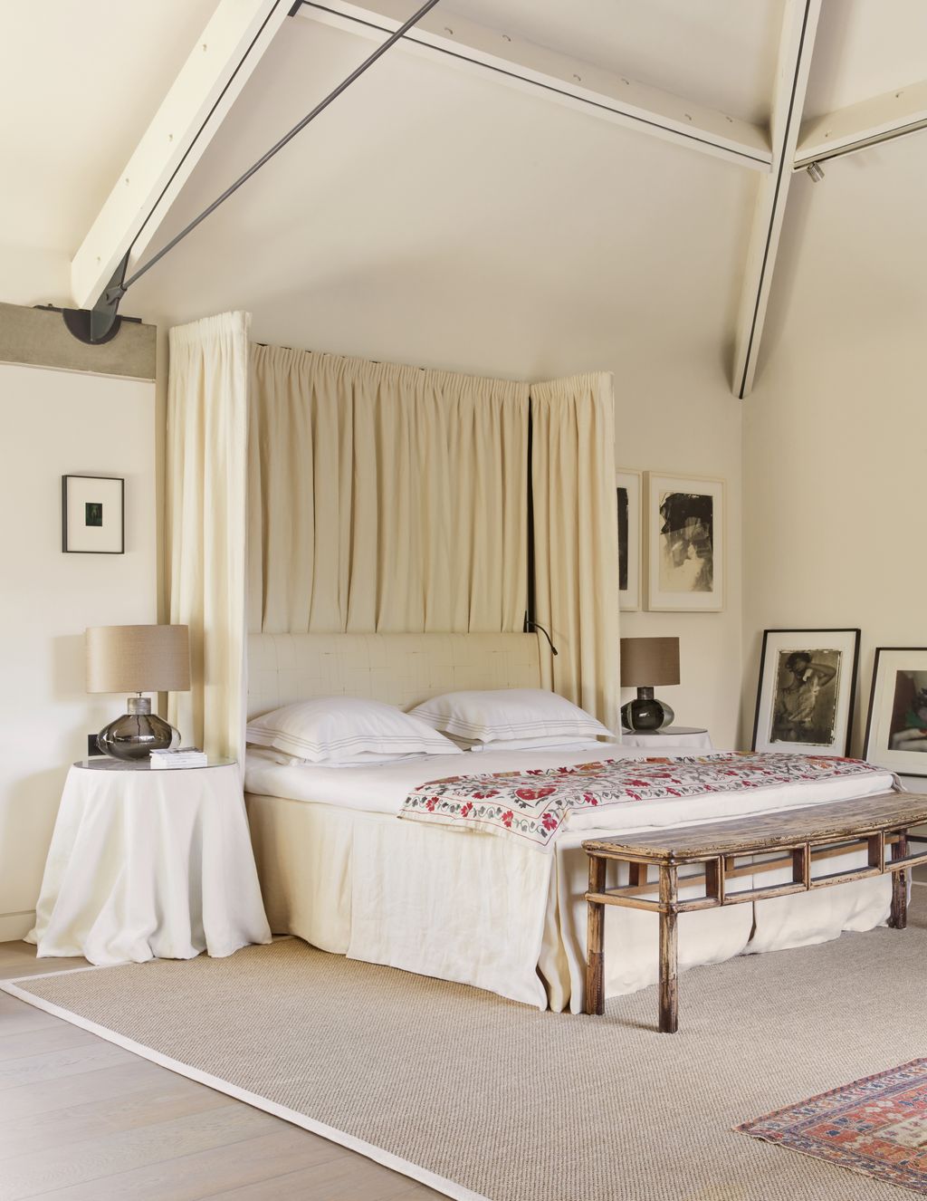 Image may contain Lamp Furniture Bed Bedroom Indoors Room Art Painting Bench Home Decor Rug and Person