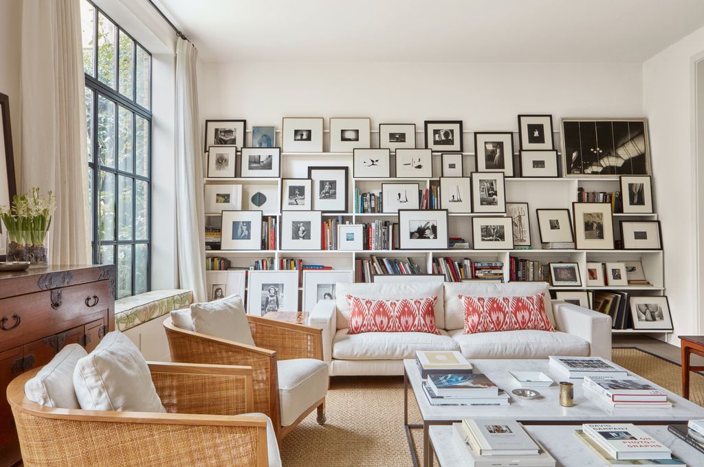 Image may contain Home Decor Couch Furniture Architecture Building Indoors Living Room Room Art Painting and Table