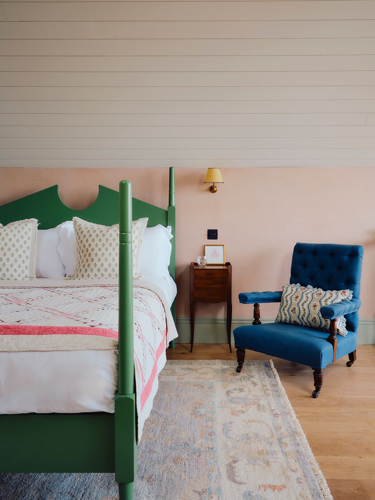 Image may contain Chair Furniture Lamp Home Decor Bed Cushion Rug Cup Indoors Interior Design Bedroom and Room