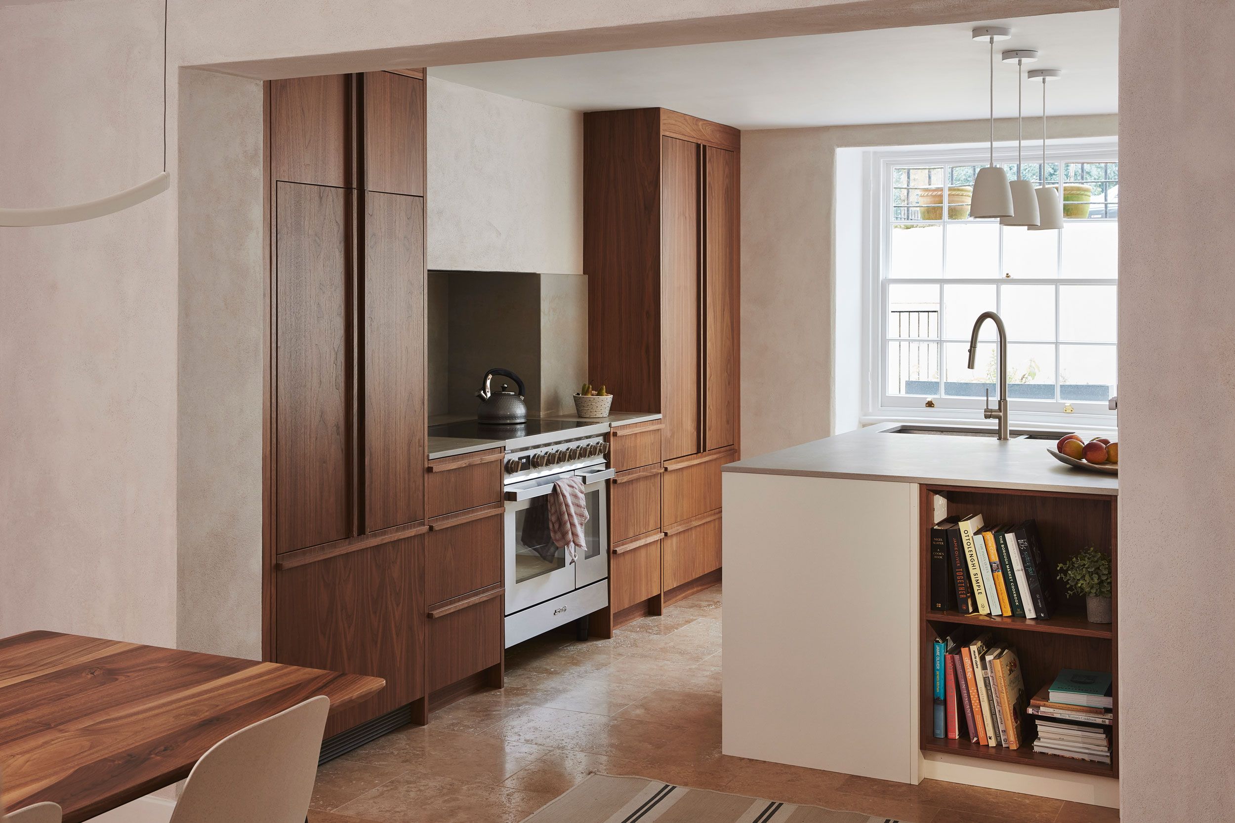 Image may contain: Indoors, Interior Design, Plant, Desk, Furniture, Table, Sink, Sink Faucet, Lamp, Chair, and Kitchen