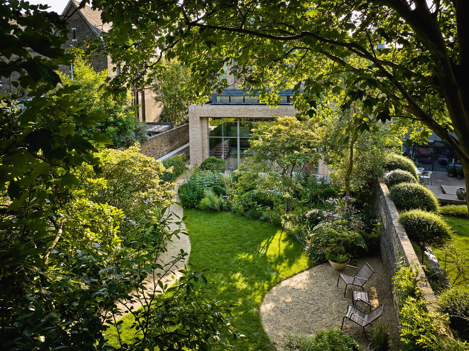 Image may contain Garden Nature Outdoors Backyard Yard Grass Plant Chair Furniture Architecture and Building