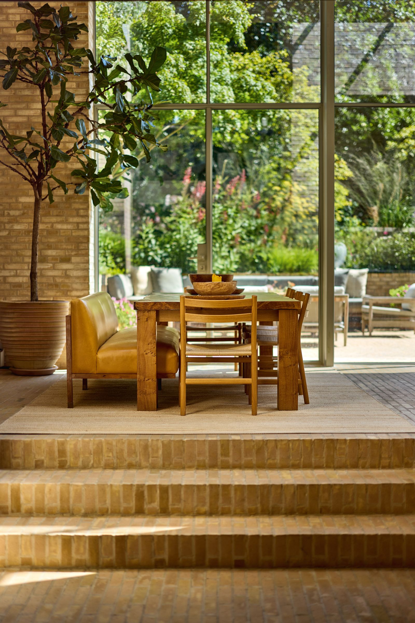 Image may contain Floor Indoors Interior Design Flooring Wood Plant Chair Furniture Desk Table and Potted Plant