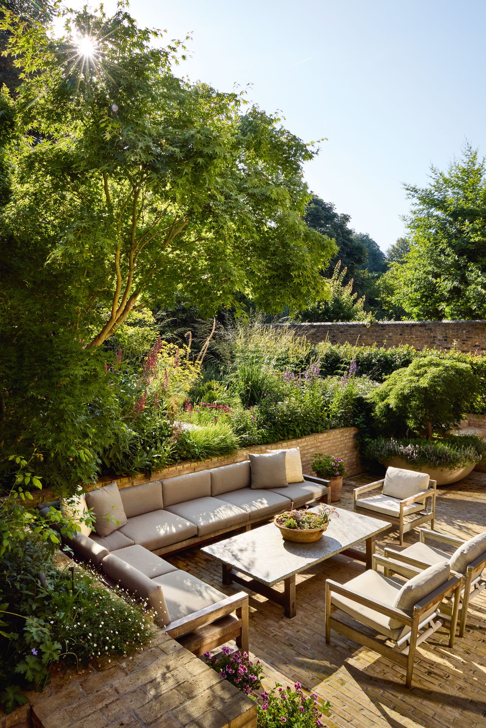 Image may contain Backyard Nature Outdoors Yard Furniture Table Chair Garden Couch Architecture and Building