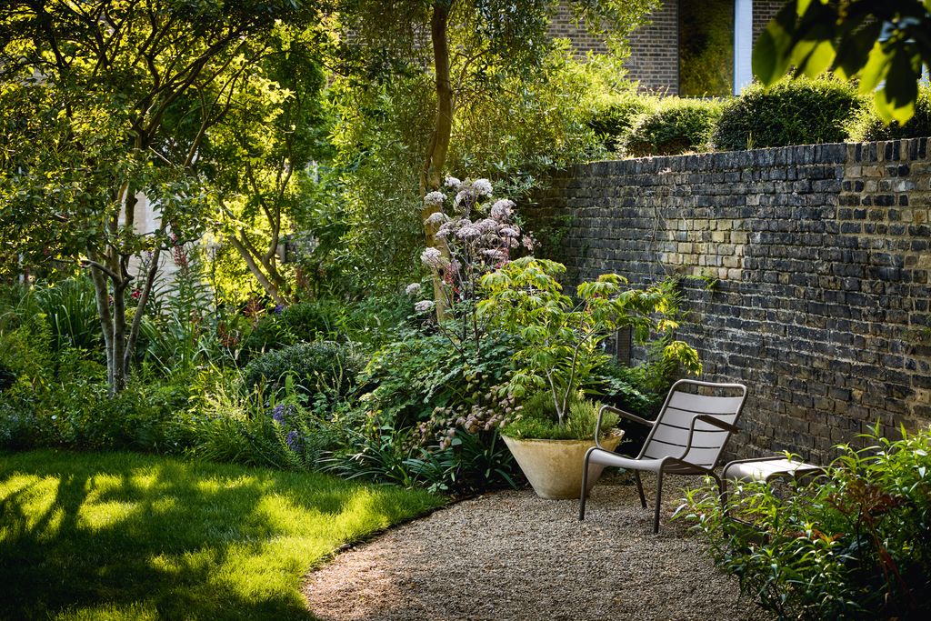 Image may contain Backyard Nature Outdoors Yard Garden Grass Plant Chair Furniture Vegetation and Architecture