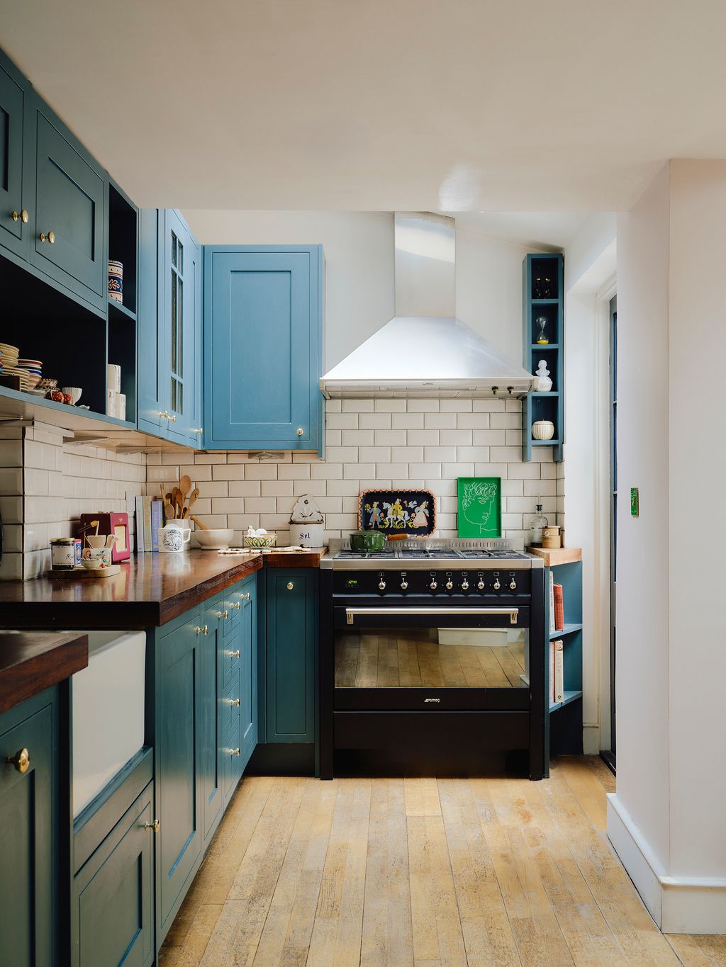 Image may contain Indoors Interior Design Kitchen Cup Cooktop Kitchen Island Sink and Sink Faucet