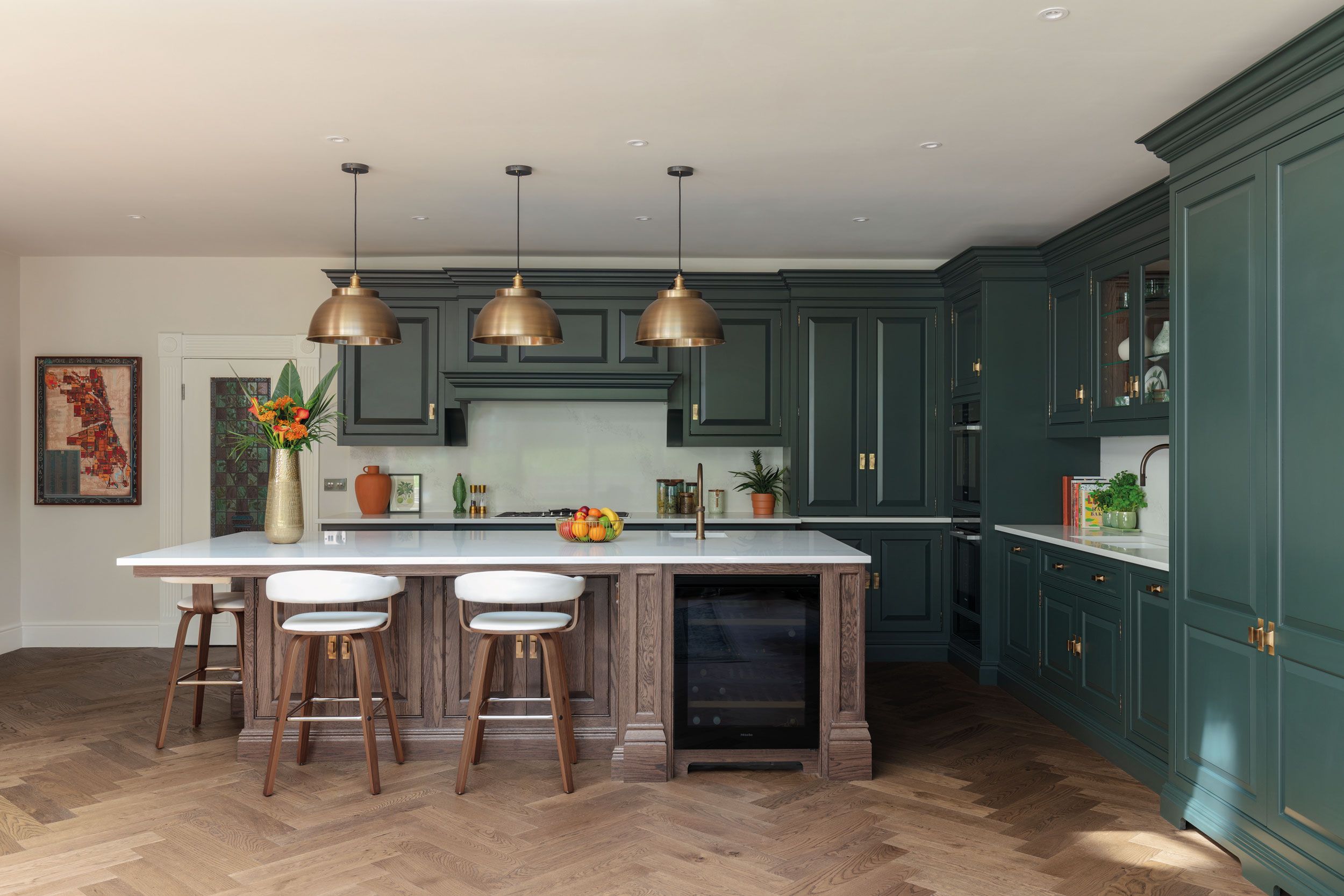 Image may contain: Indoors, Interior Design, Kitchen, Kitchen Island, Plant, Furniture, Dining Table, and Table