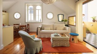 Image may contain Home Decor Couch Furniture Plant Architecture Building Indoors Living Room and Room