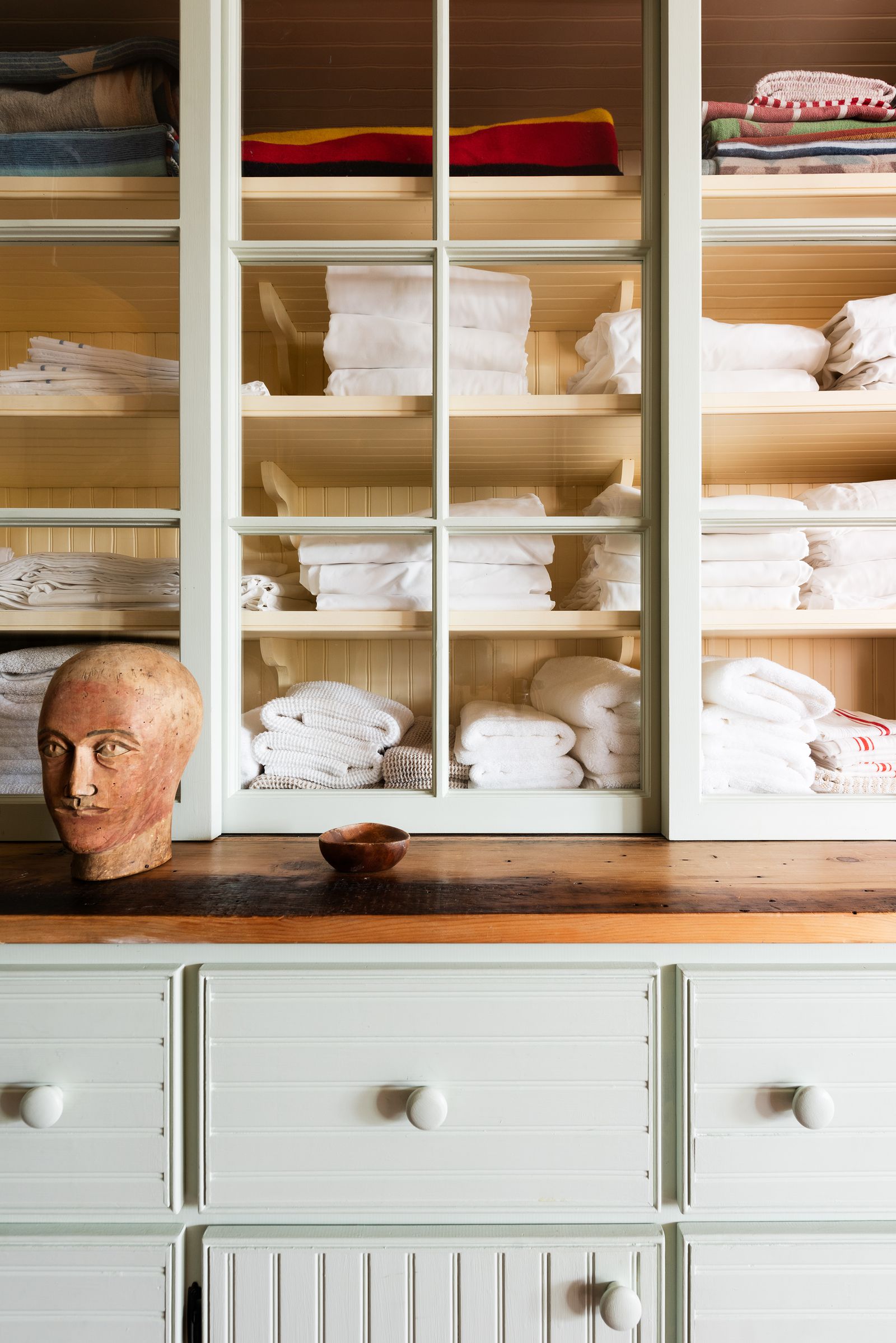 Image may contain Closet Cupboard Furniture Home Decor Linen Adult Person and Cabinet