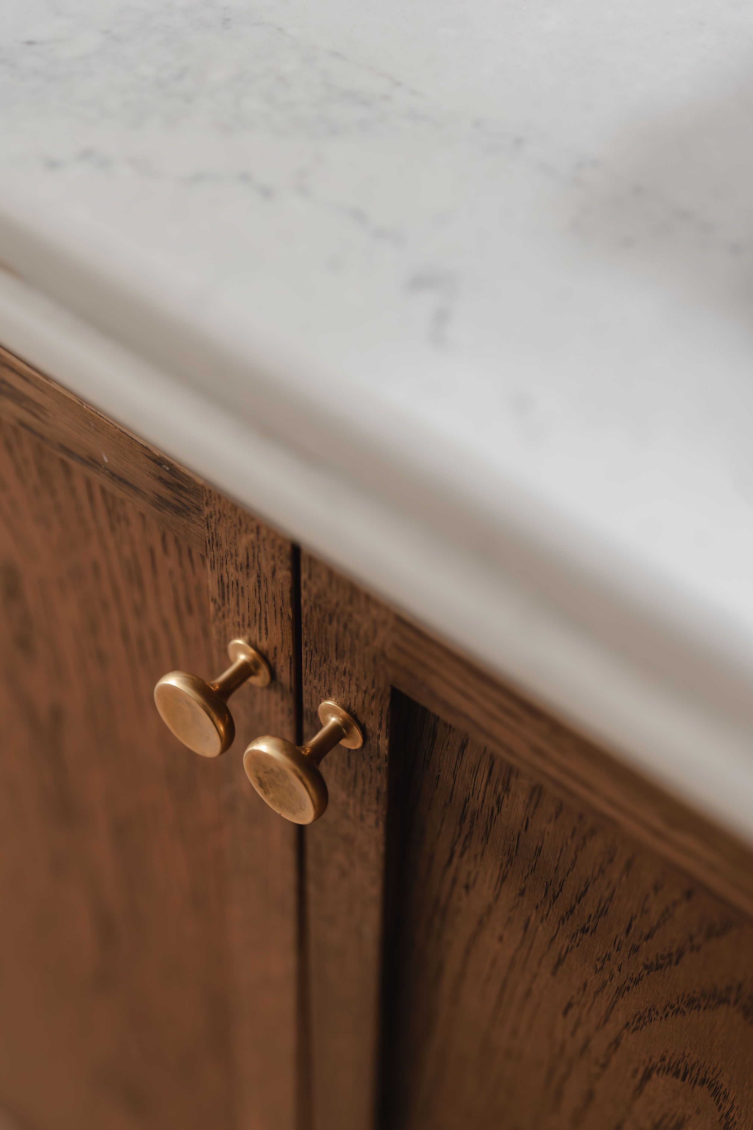 Image may contain: Indoors, Interior Design, Cabinet, Furniture, Sink, Sink Faucet, Hardwood, Stained Wood, Wood, and Window