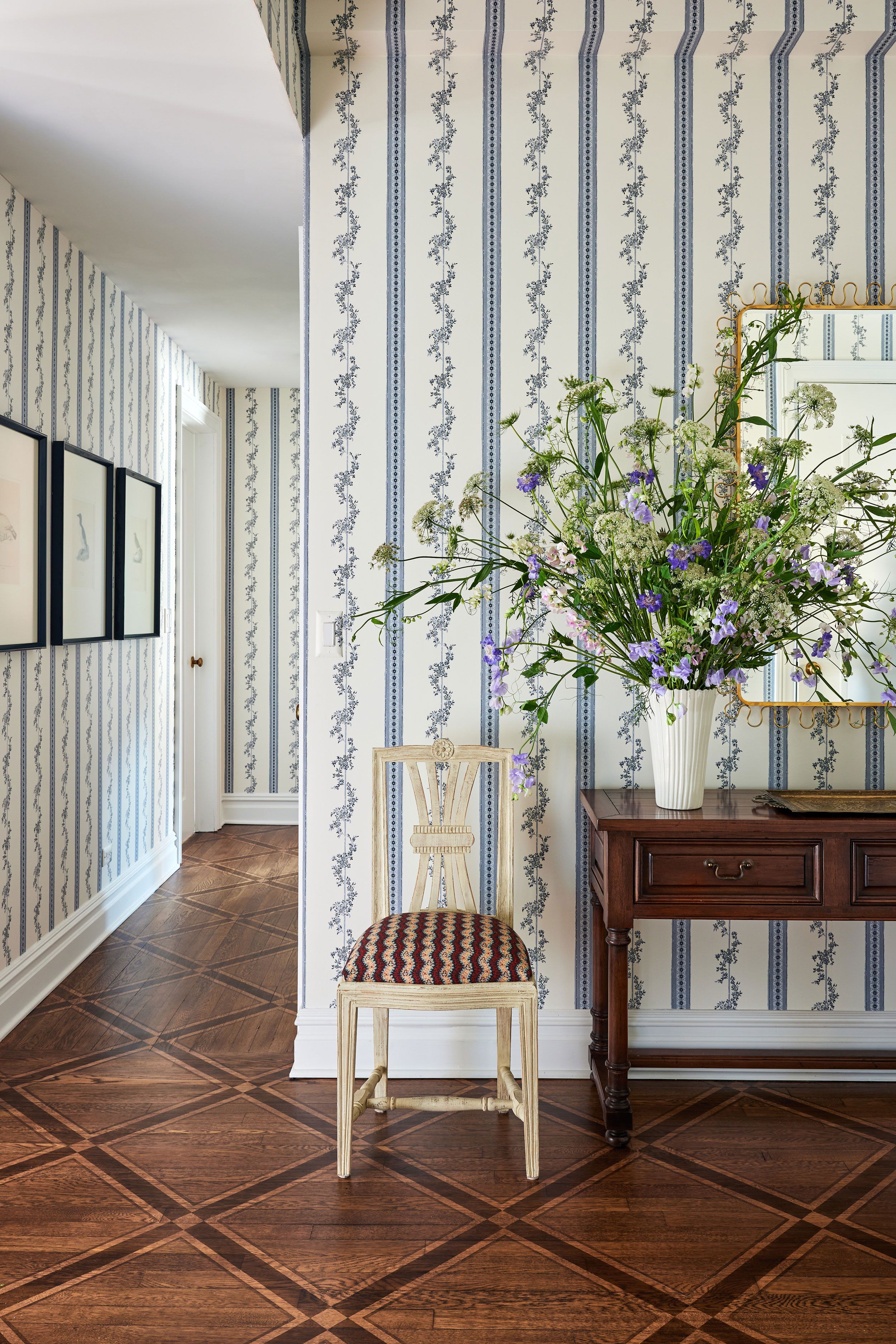 Image may contain: Indoors, Interior Design, Floor, Flooring, Chair, Furniture, Wood, Art, Painting, and Hardwood