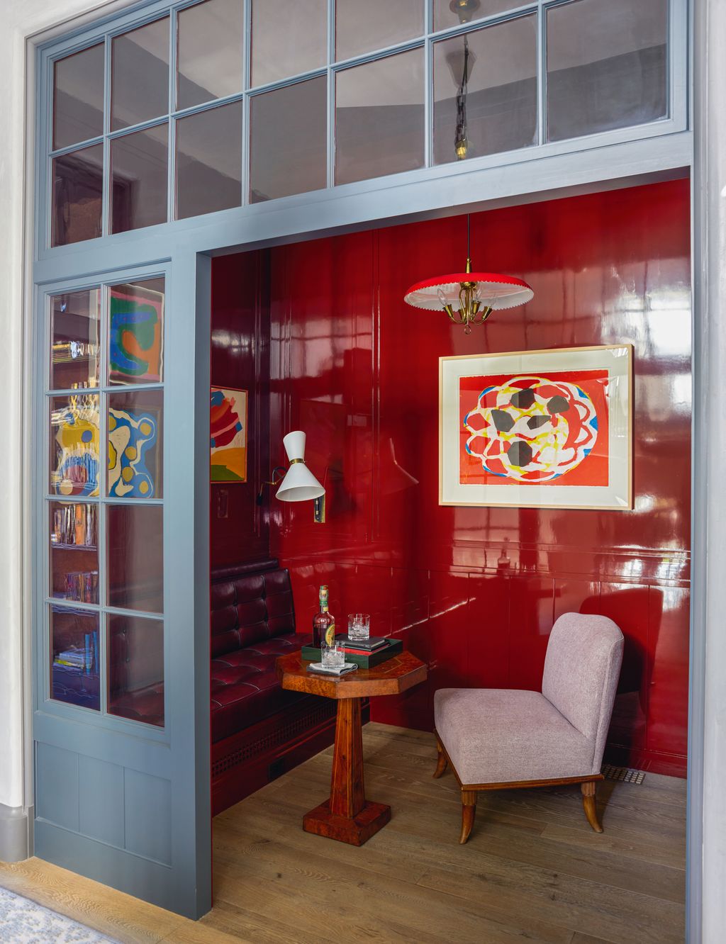 Image may contain Indoors Interior Design Door Lamp Chair Furniture Desk Table Cup Art Painting and Floor