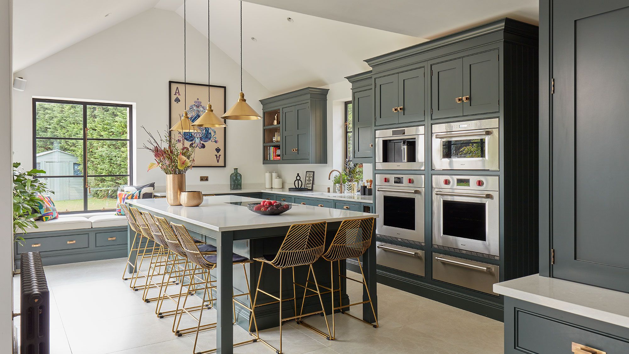 Image may contain: Indoors, Interior Design, Kitchen, Kitchen Island, Plant, Appliance, Device, and Electrical Device