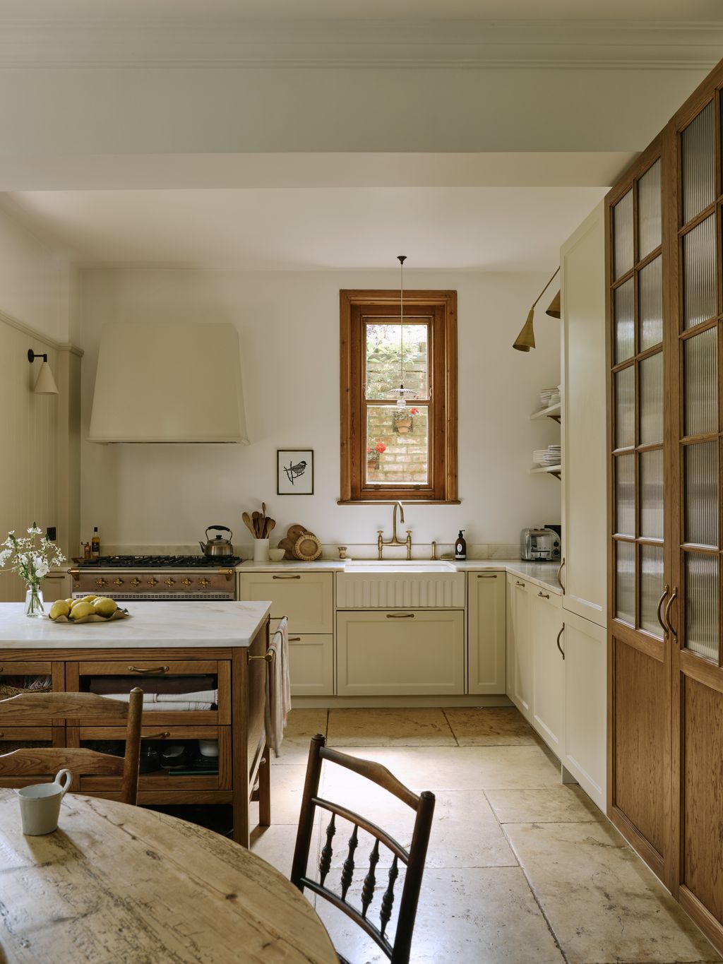 Image may contain Indoors Interior Design Chair Furniture Kitchen Architecture Building Dining Room and Dining Table