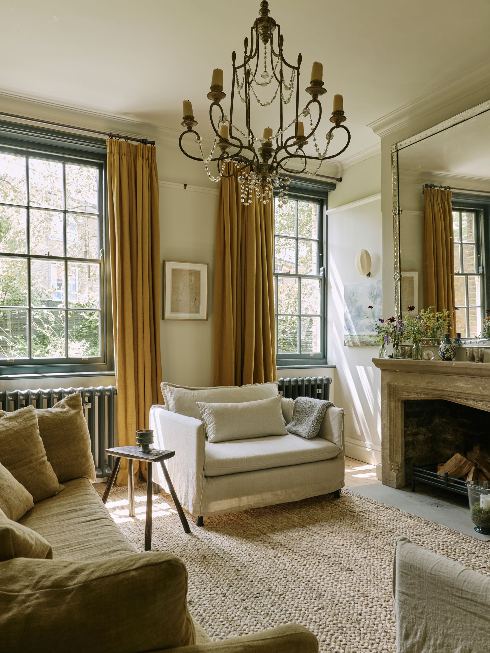 Image may contain Home Decor Chandelier Lamp Art Painting Cup Couch Furniture Architecture Building and Indoors