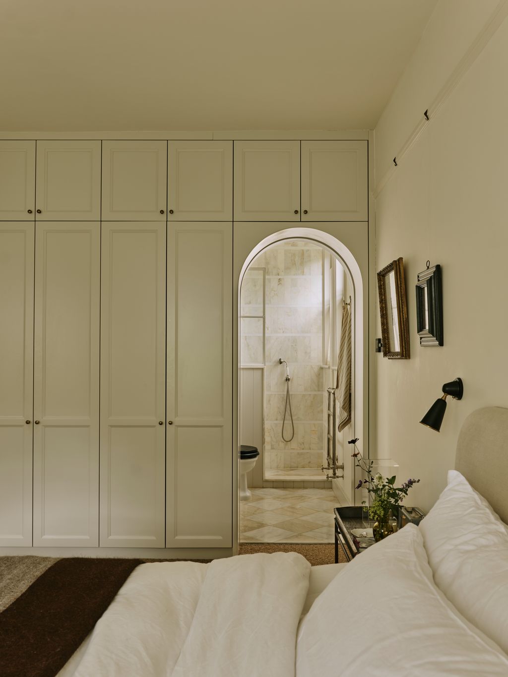 Image may contain Indoors Interior Design Lamp Closet Furniture Wardrobe Art Painting Bathroom Room and Toilet