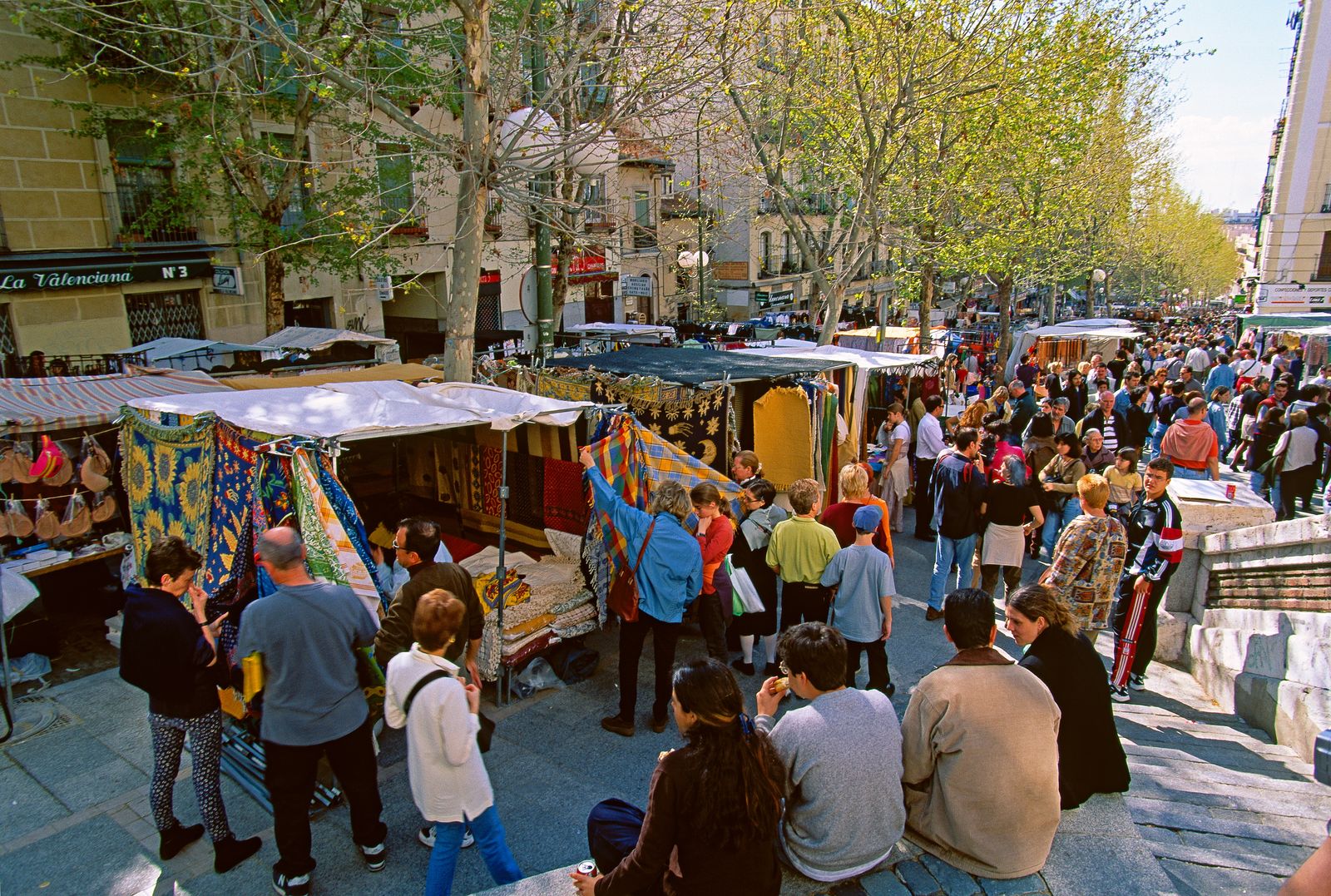 Image may contain Urban Accessories Bag Handbag Clothing Footwear Shoe People Person Adult City Hat and Market