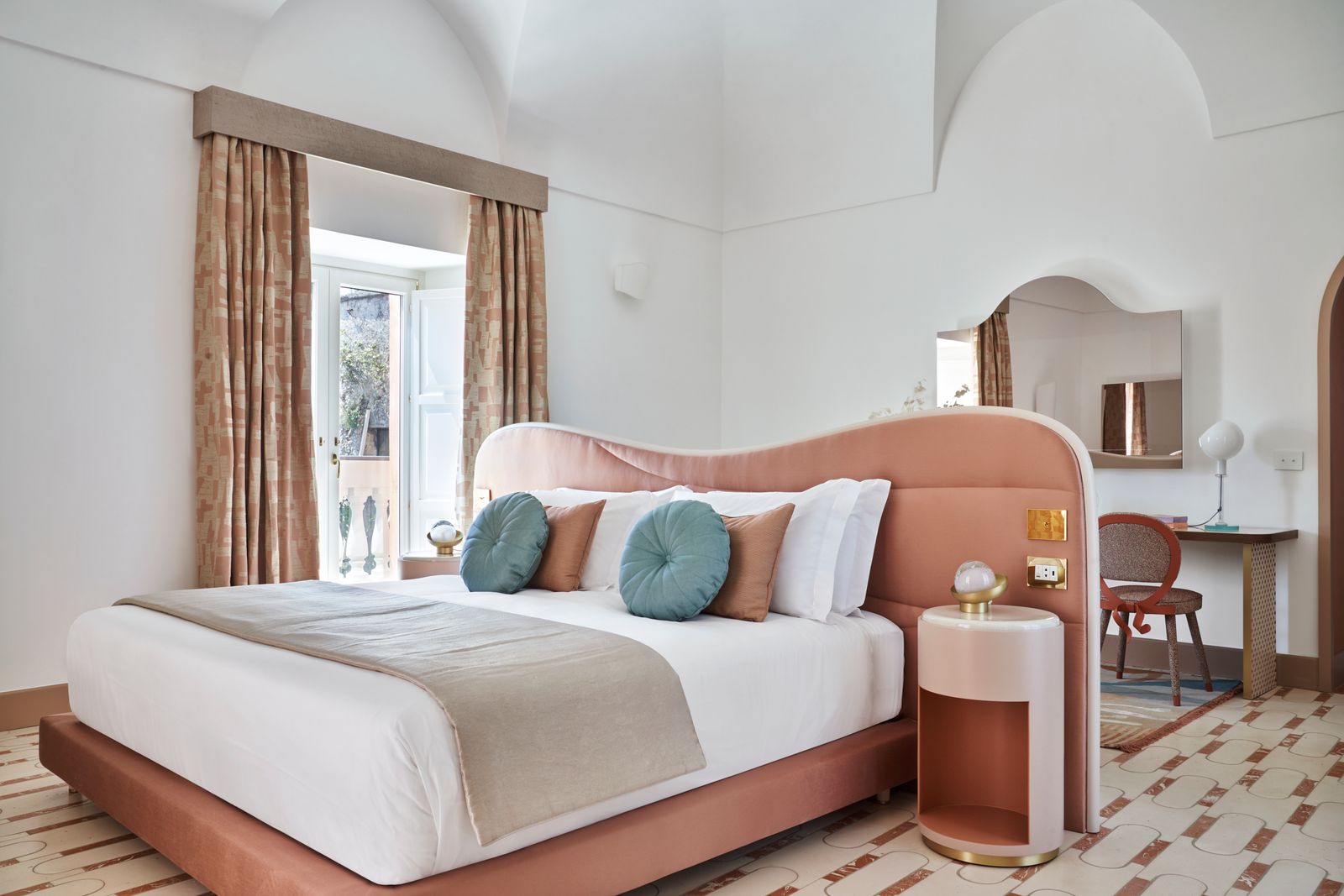 Image may contain Home Decor Indoors Interior Design Cushion Chair Furniture Lamp Corner Bed Pillow and Bedroom