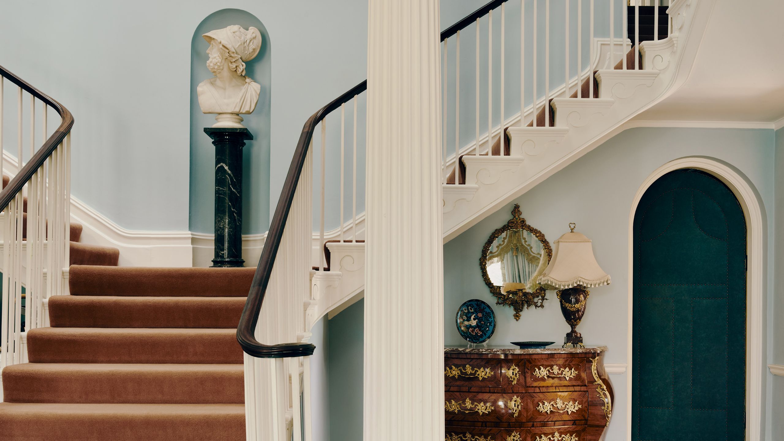 Image may contain: Architecture, Building, House, Housing, Staircase, Lamp, Handrail, Person, Plate, Indoors, and Foyer