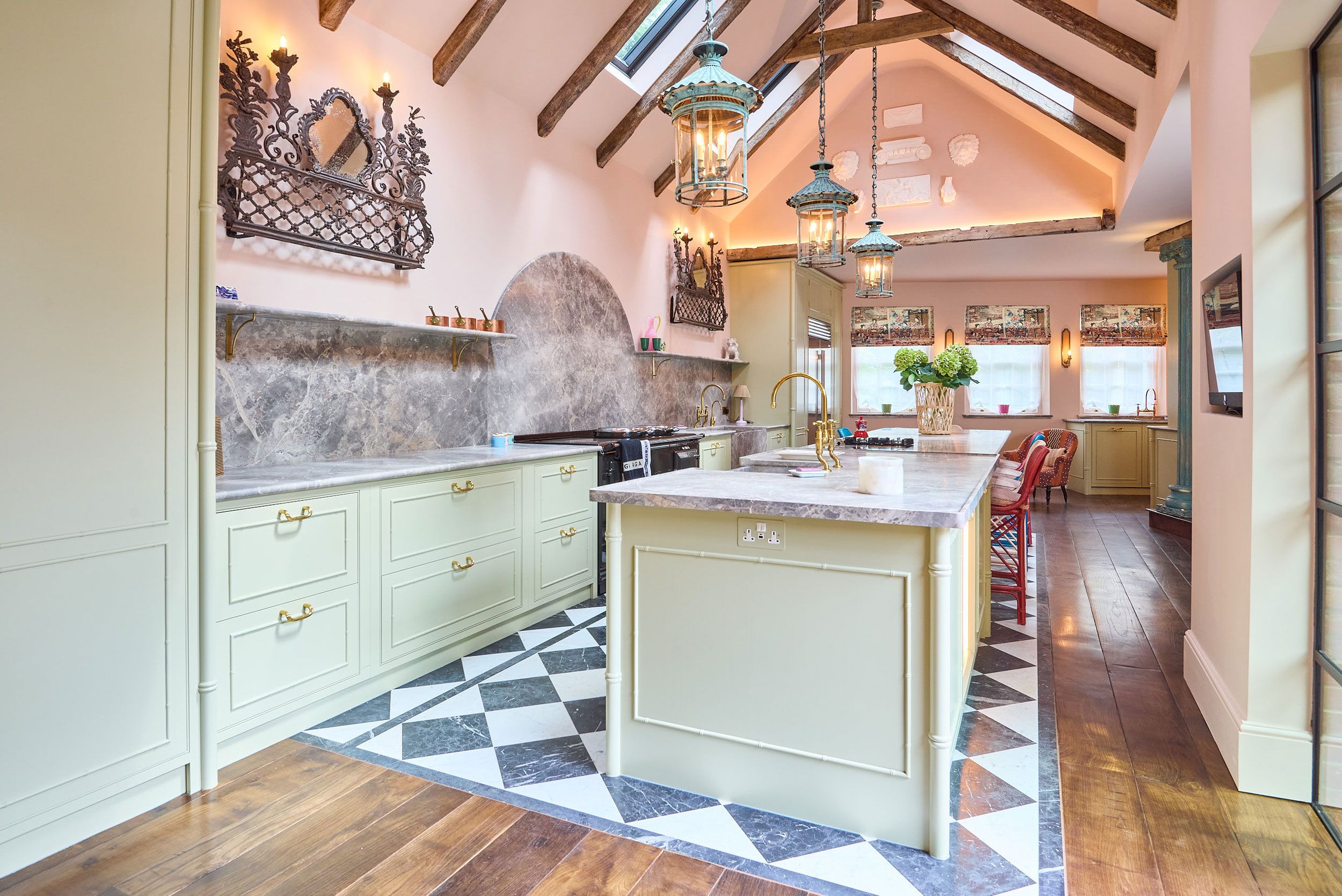 Image may contain: Indoors, Interior Design, Kitchen, Chandelier, Lamp, Home Decor, Plant, Floor, Sink, and Sink Faucet