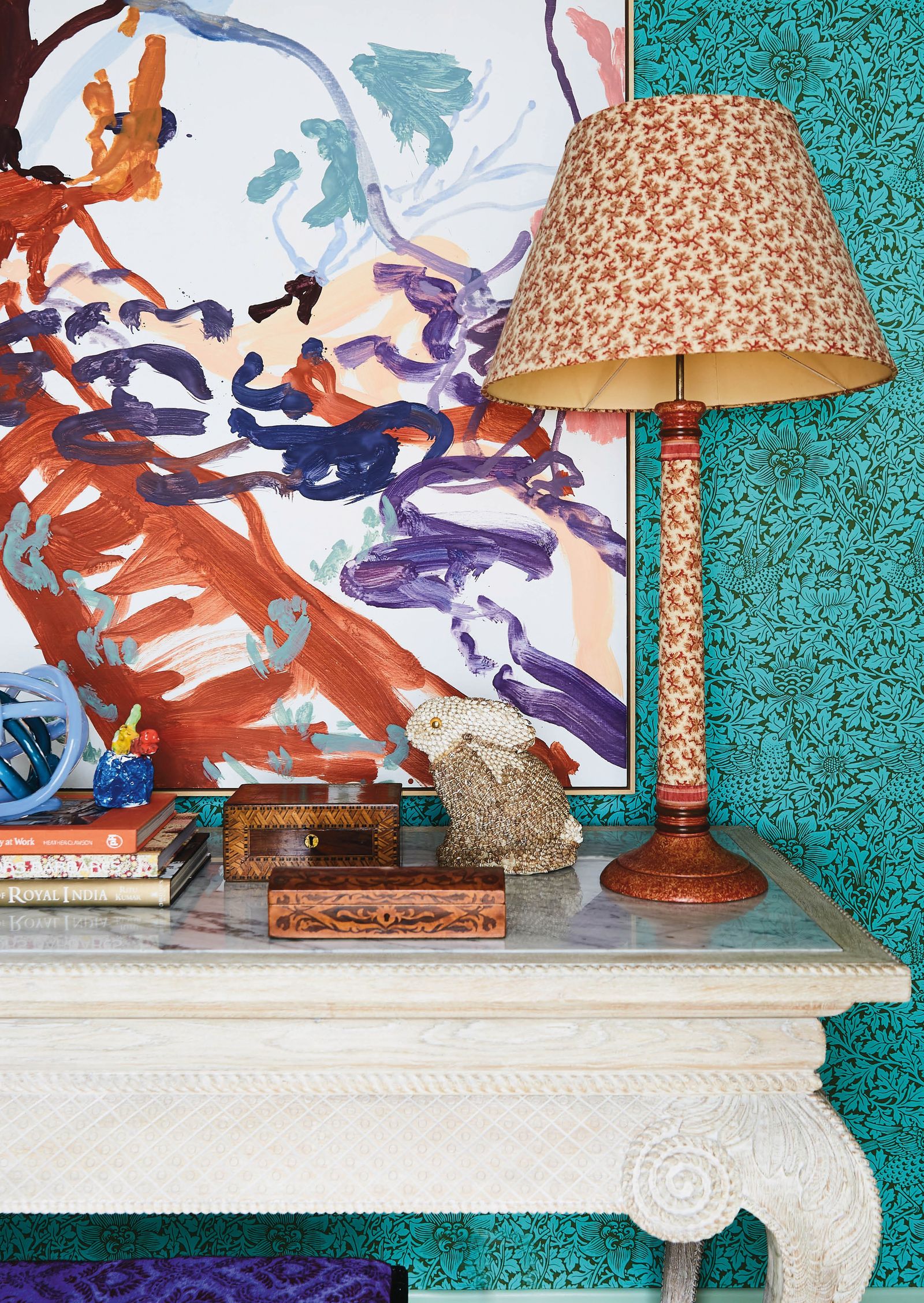 Image may contain Lamp Table Lamp Book Publication Desk Furniture Table Box and Helmet