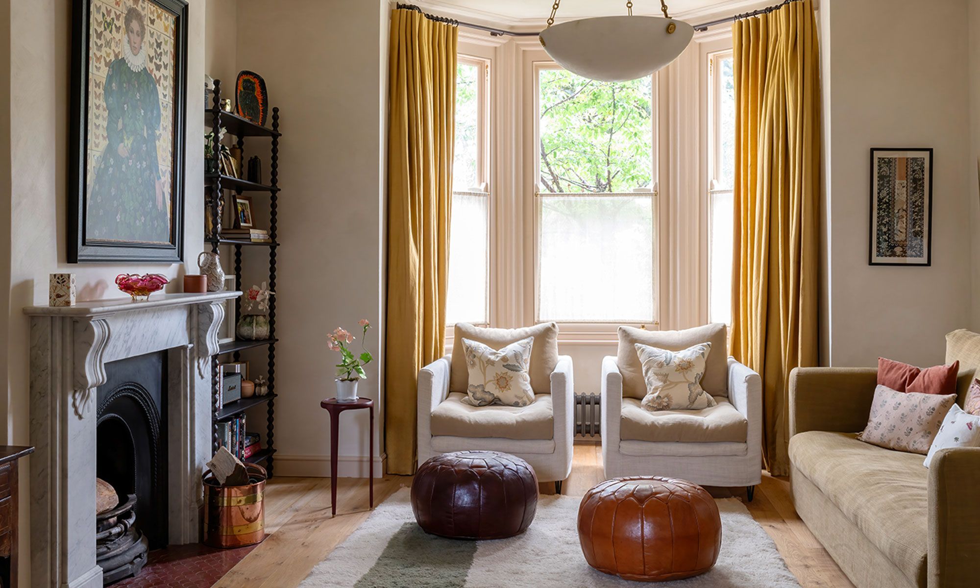 Image may contain: Home Decor, Rug, Art, Painting, Couch, Furniture, Chair, Desk, Table, Window, Accessories, and Bag