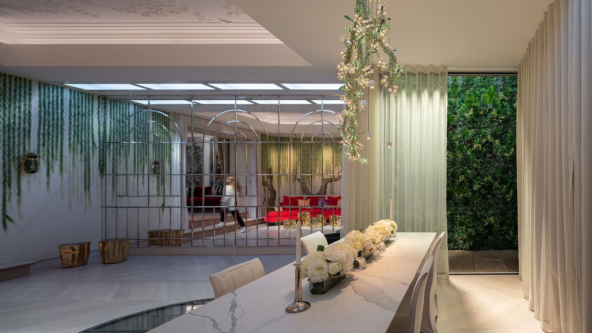 Image may contain: Chair, Furniture, Person, Architecture, Building, Indoors, Living Room, Room, Interior Design, and Foyer