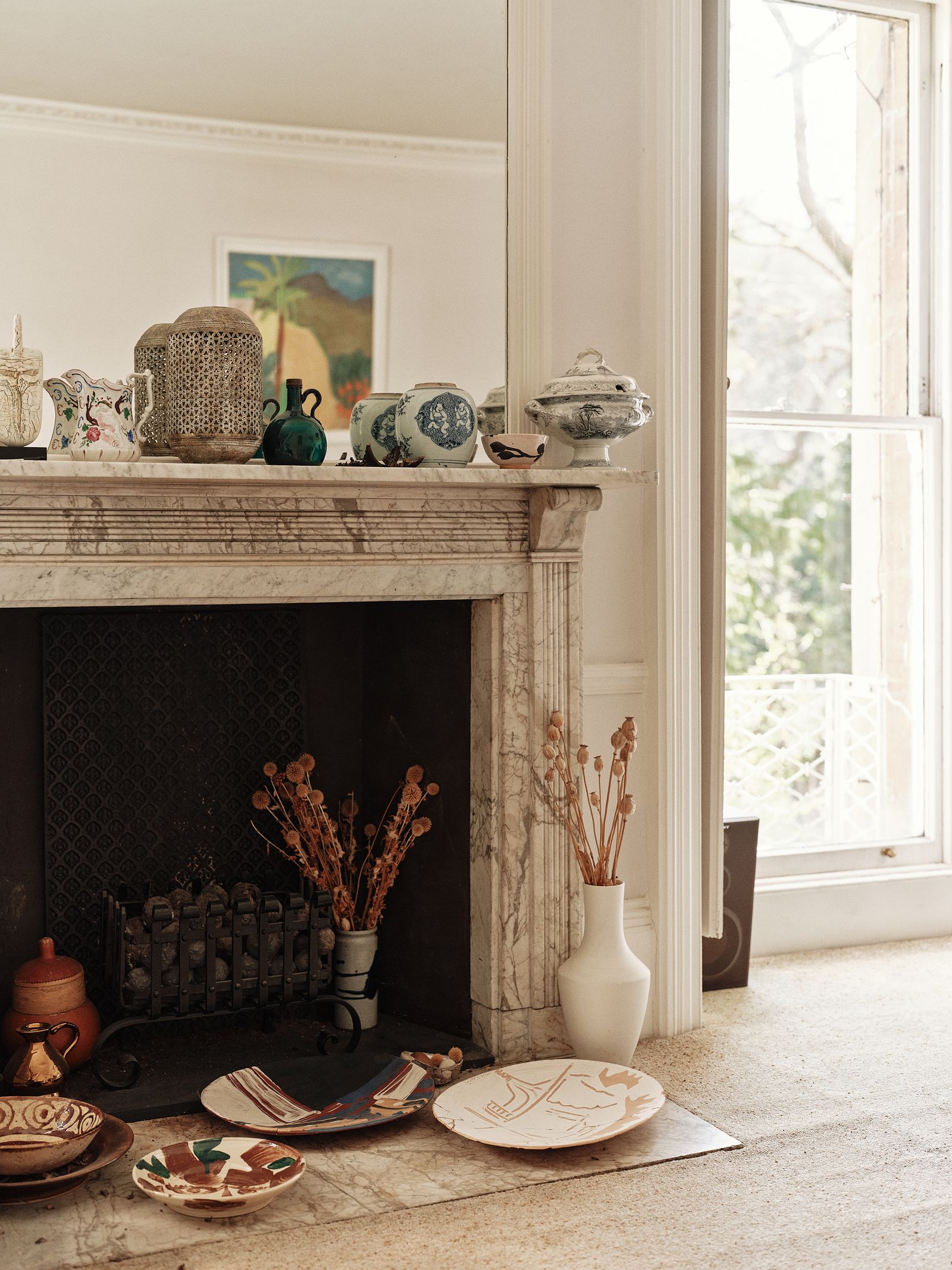 Image may contain Fireplace Indoors Plate Art Painting Interior Design Hearth Furniture Table and Home Decor